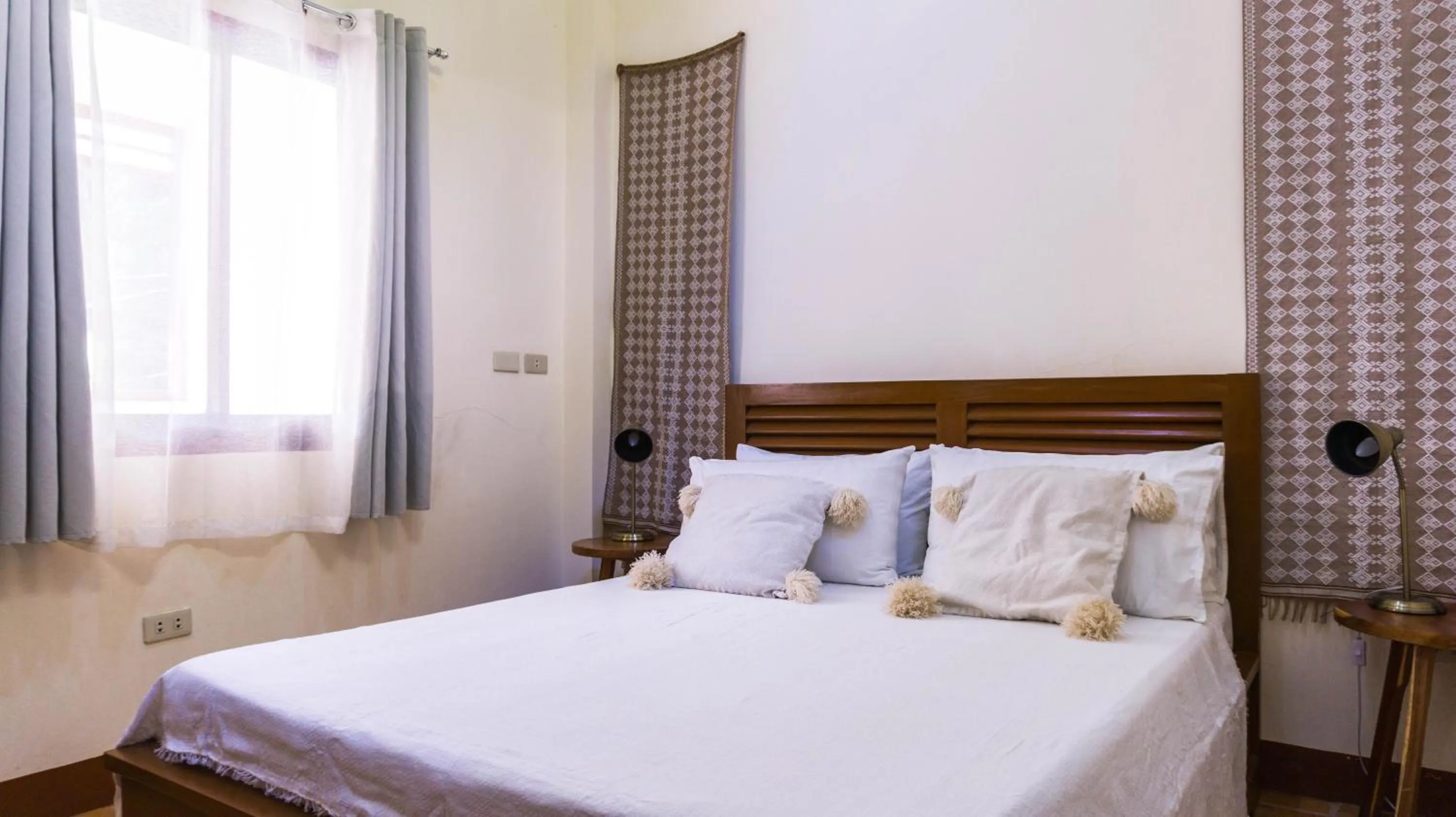 Bed in Talisay Boutique Hotel
