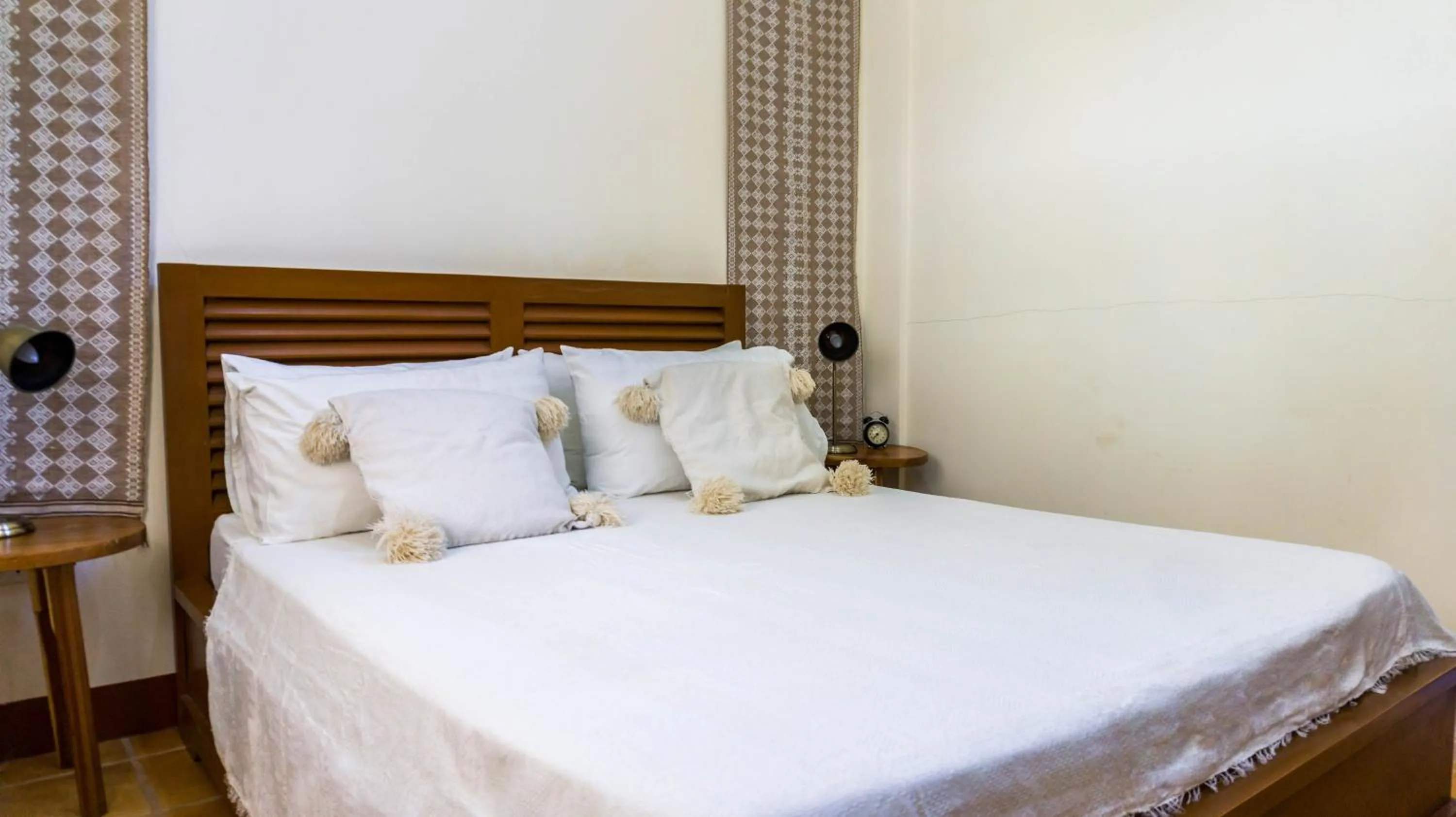 Bed in Talisay Boutique Hotel