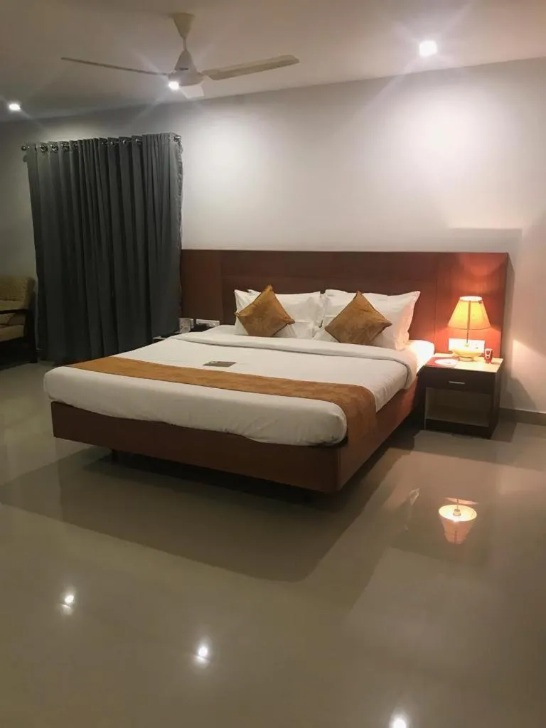 Bed in Kallada Sangeetha Hotels