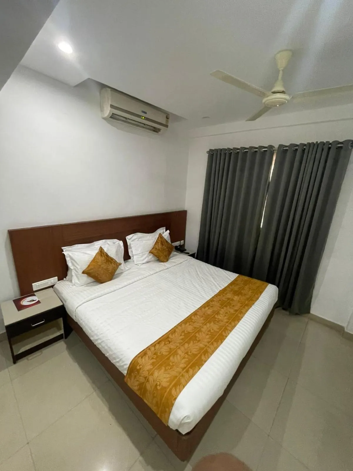 Bed in Kallada Sangeetha Hotels