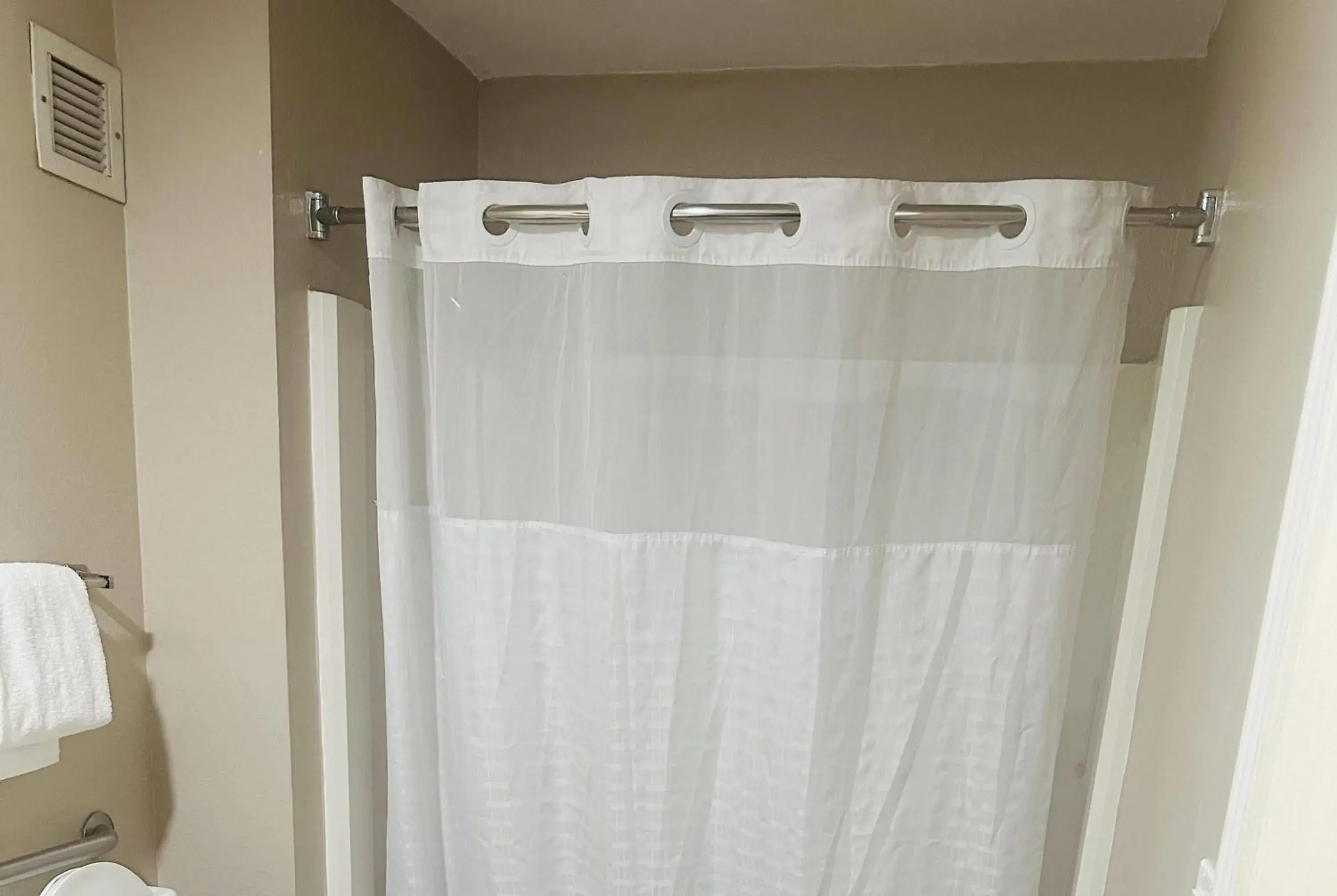 Bathroom in Super 8 by Wyndham Bossier City/Shreveport Area Bathroom in Super 8 by Wyndham Bossier City/Shreveport Area