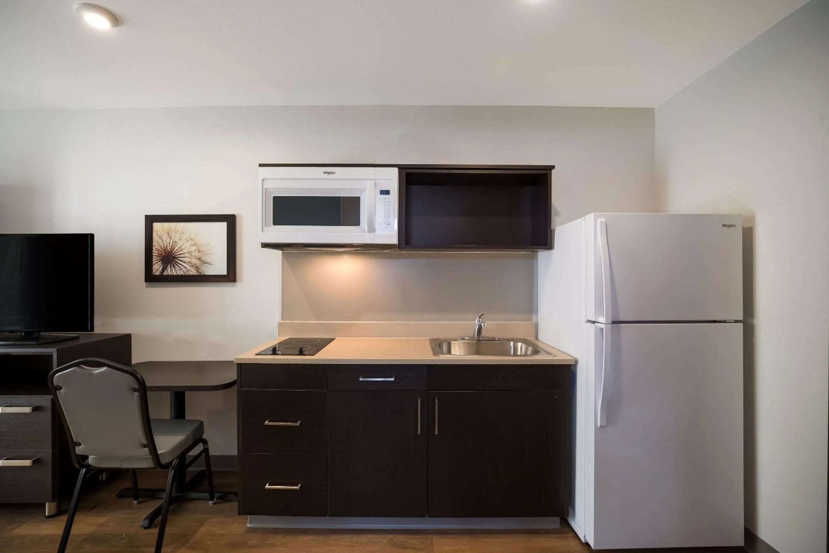 Kitchen or kitchenette in WoodSpring Suites Orlando North - Maitland