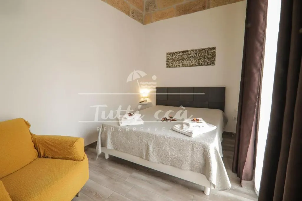 Bed in Tutti ccà Airport Rooms