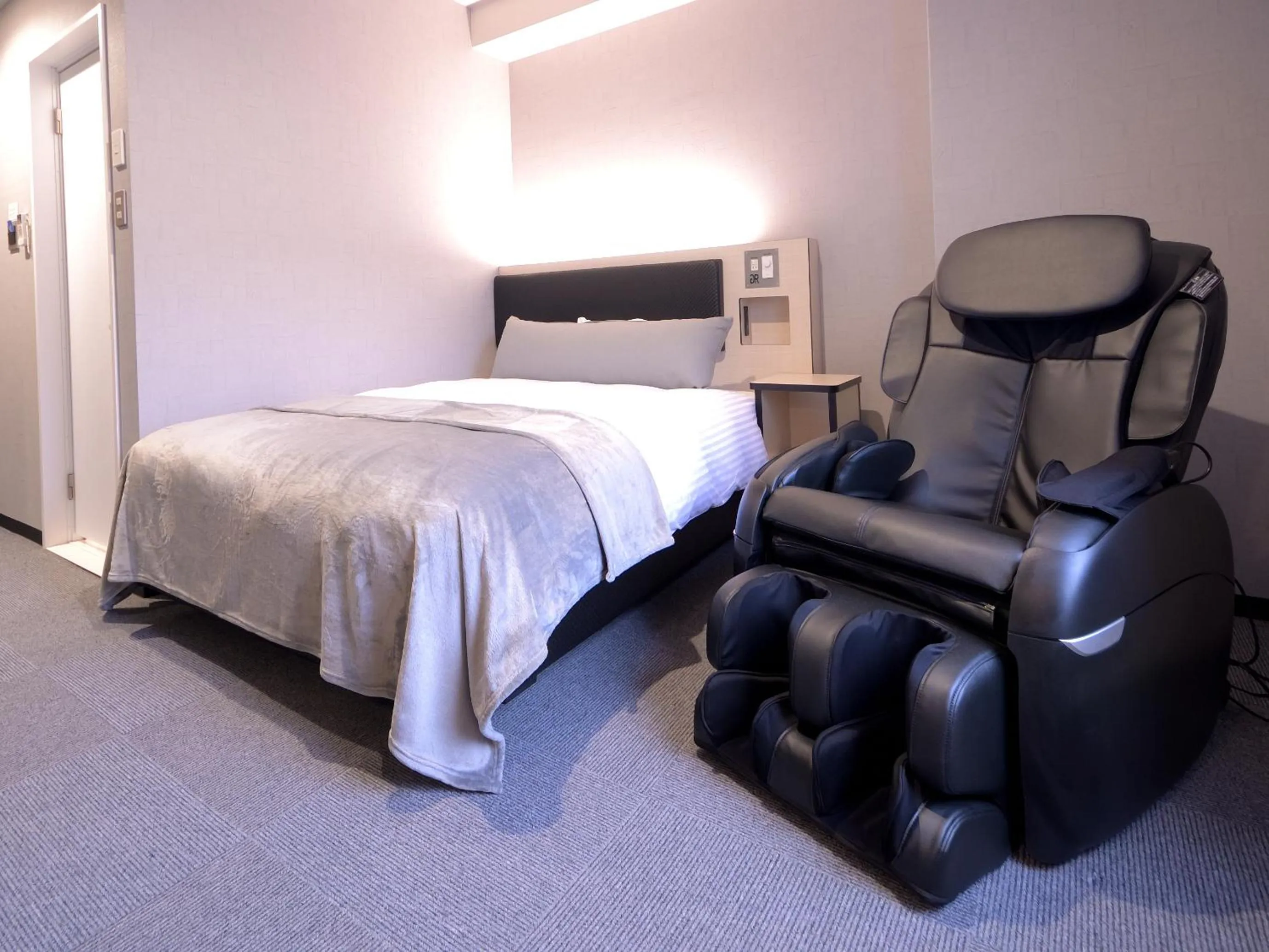 Bed in Green Rich Hotel Tottori Ekimae (Artificial hot spring Futamata Yunohana)