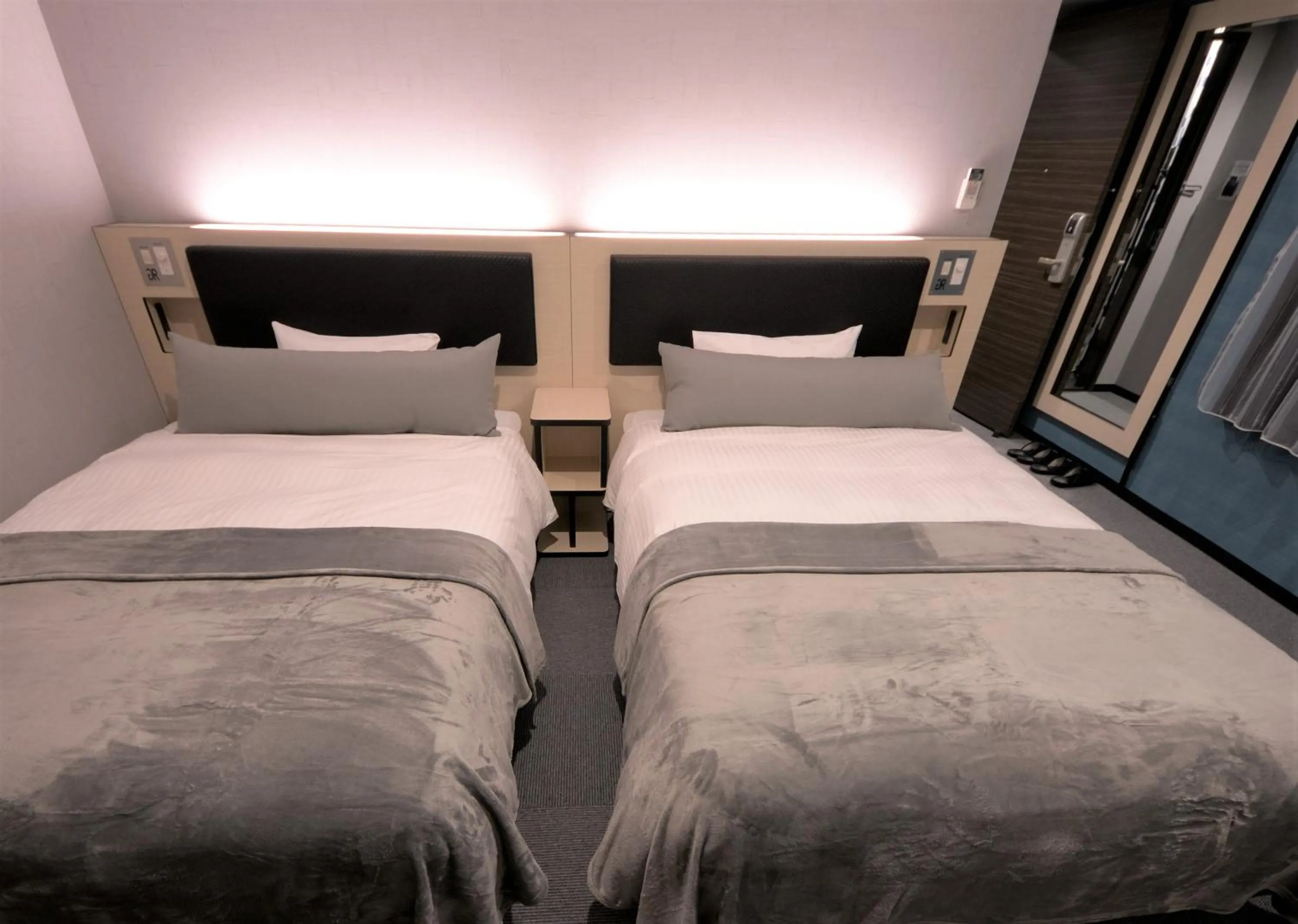 Bed in Green Rich Hotel Tottori Ekimae (Artificial hot spring Futamata Yunohana)