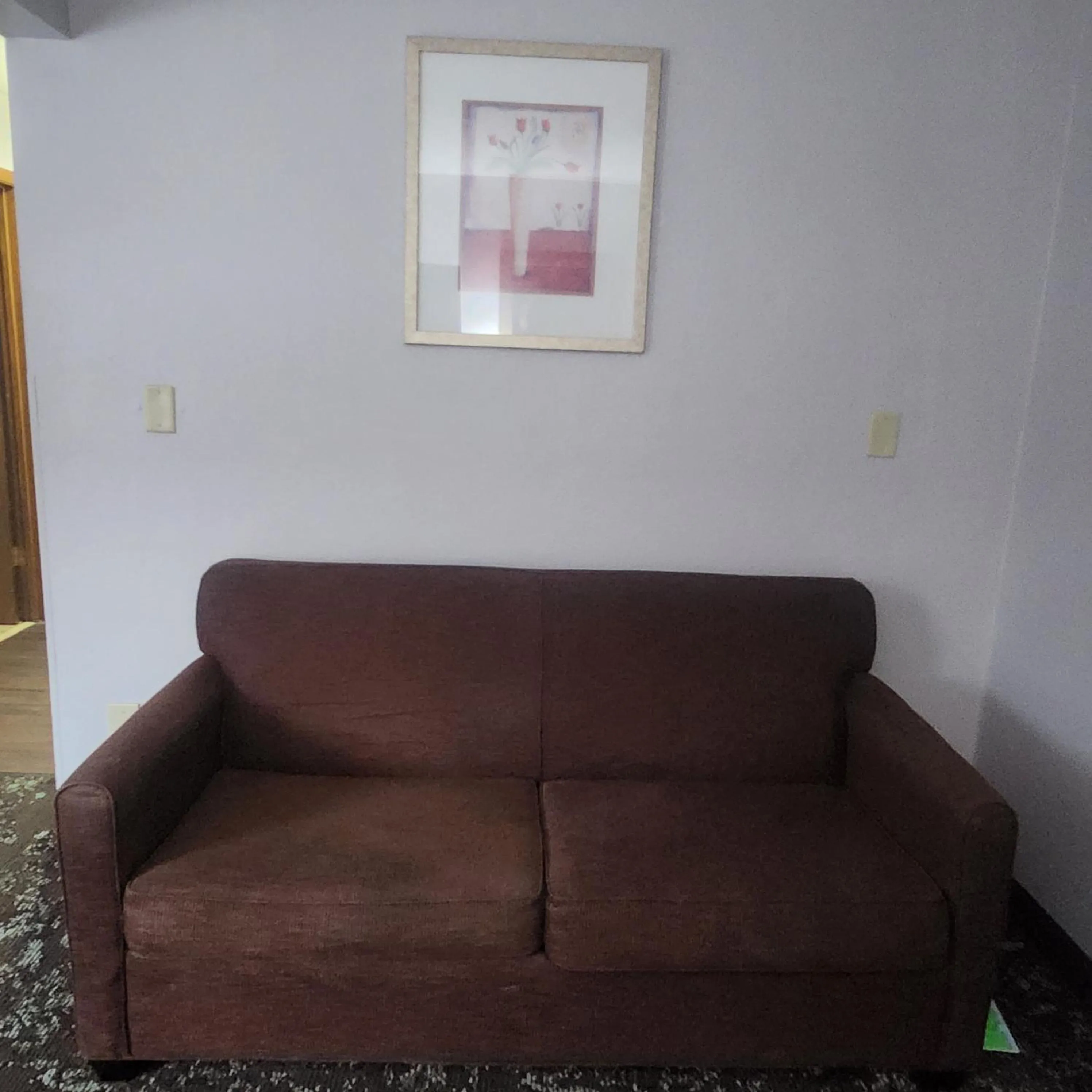 Seating area in Ramada by Wyndham Cedar Rapids South