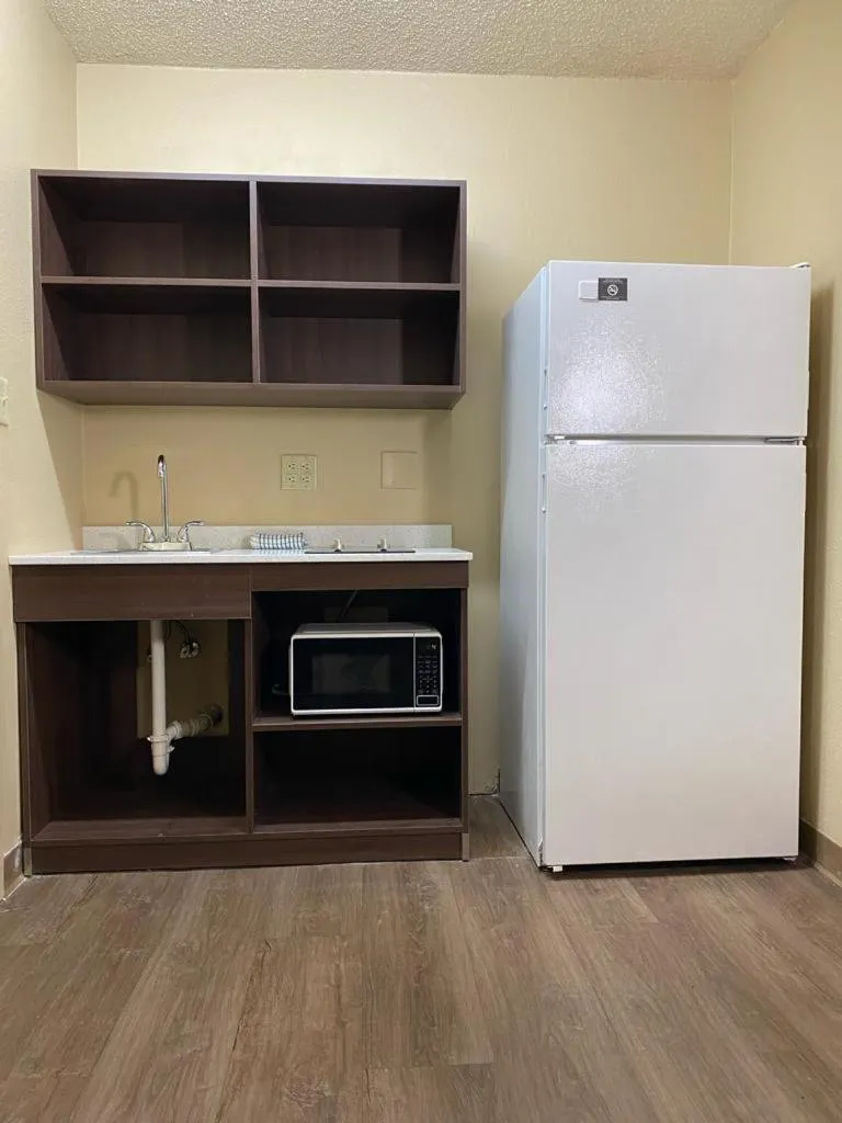 Kitchen or kitchenette in Suburban Studios Winston-Salem near Hanes Mall