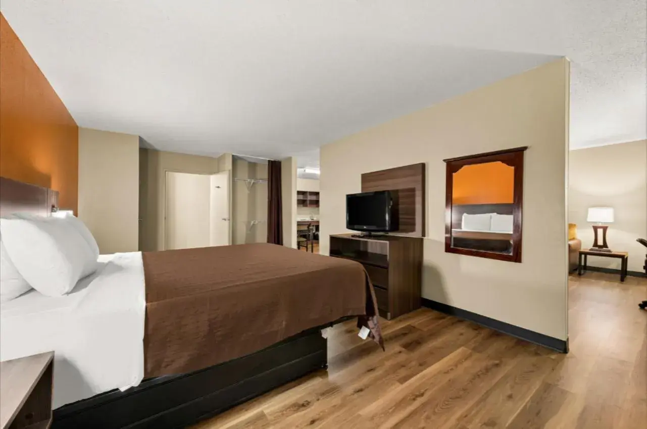 Communal lounge/ TV room, Bed in Suburban Studios Winston-Salem near Hanes Mall Communal lounge/ TV room, Bed in Suburban Studios Winston-Salem near Hanes Mall