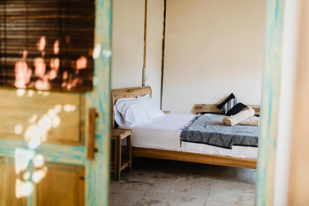 Bed in Kalyssa Beach Bungalows