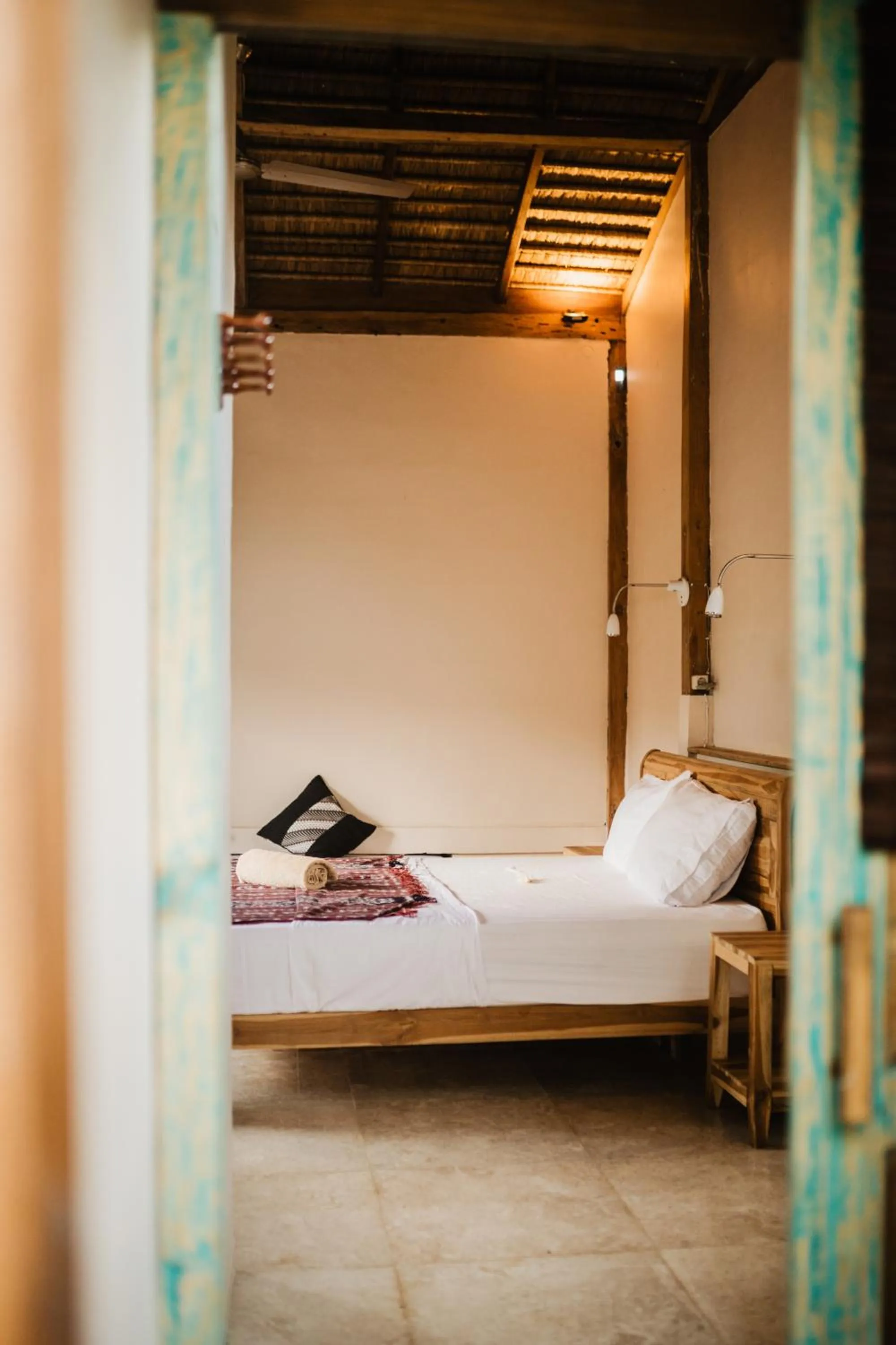 Bed in Kalyssa Beach Bungalows