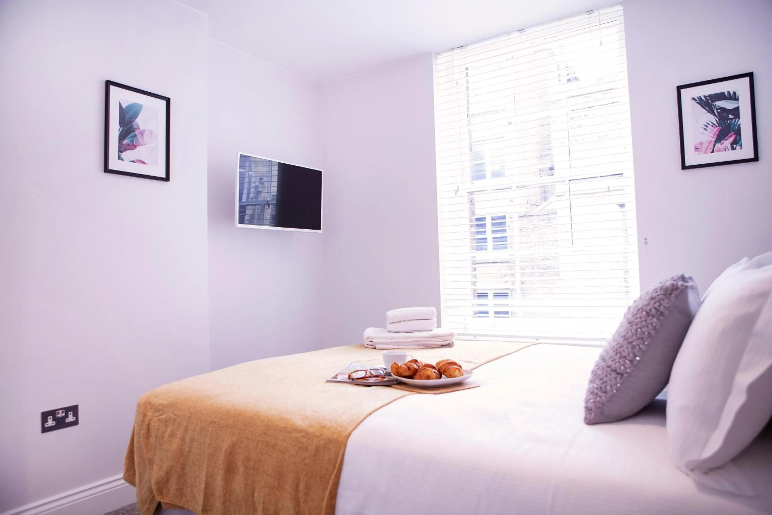 Bed in Quiet Central West End Apartments by Indigo Flats