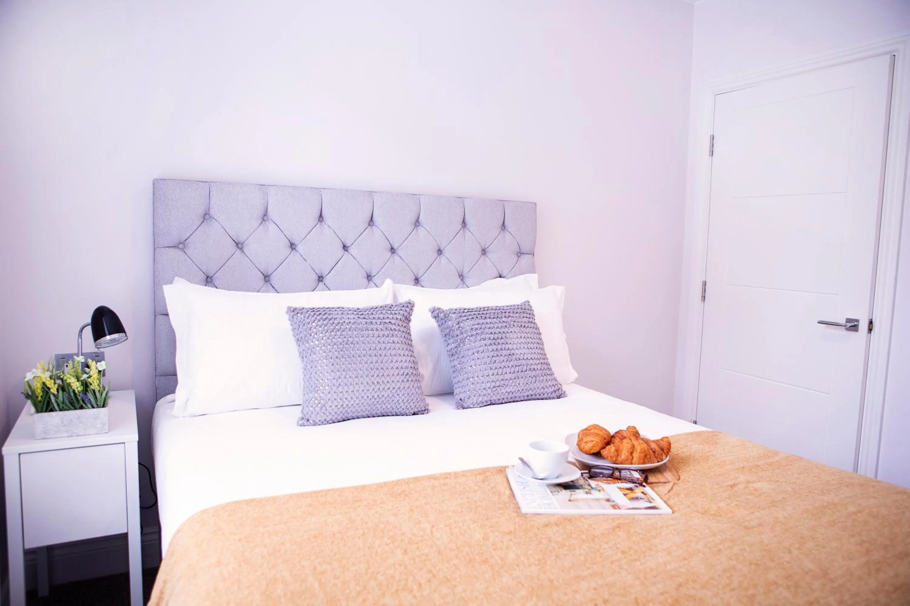 Bed in Quiet Central West End Apartments by Indigo Flats