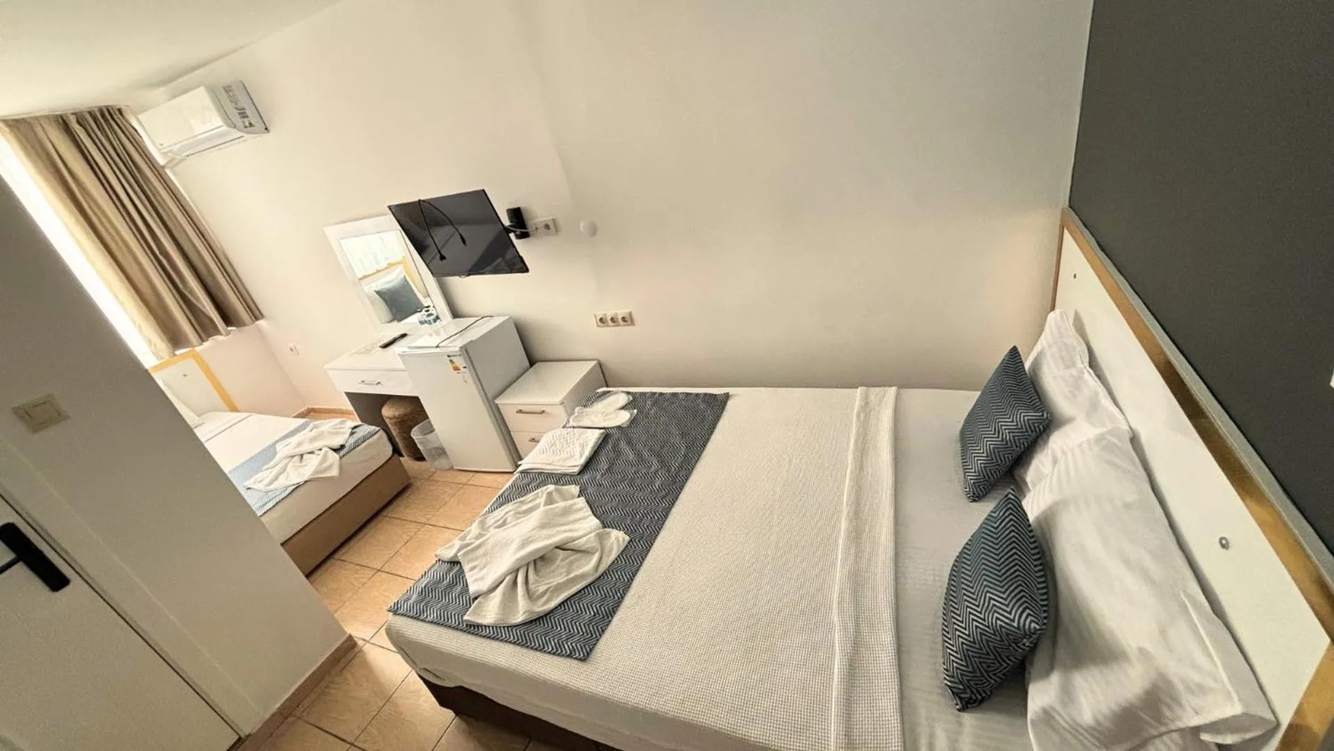 Bed in MOONBOW BEACH HOTEL