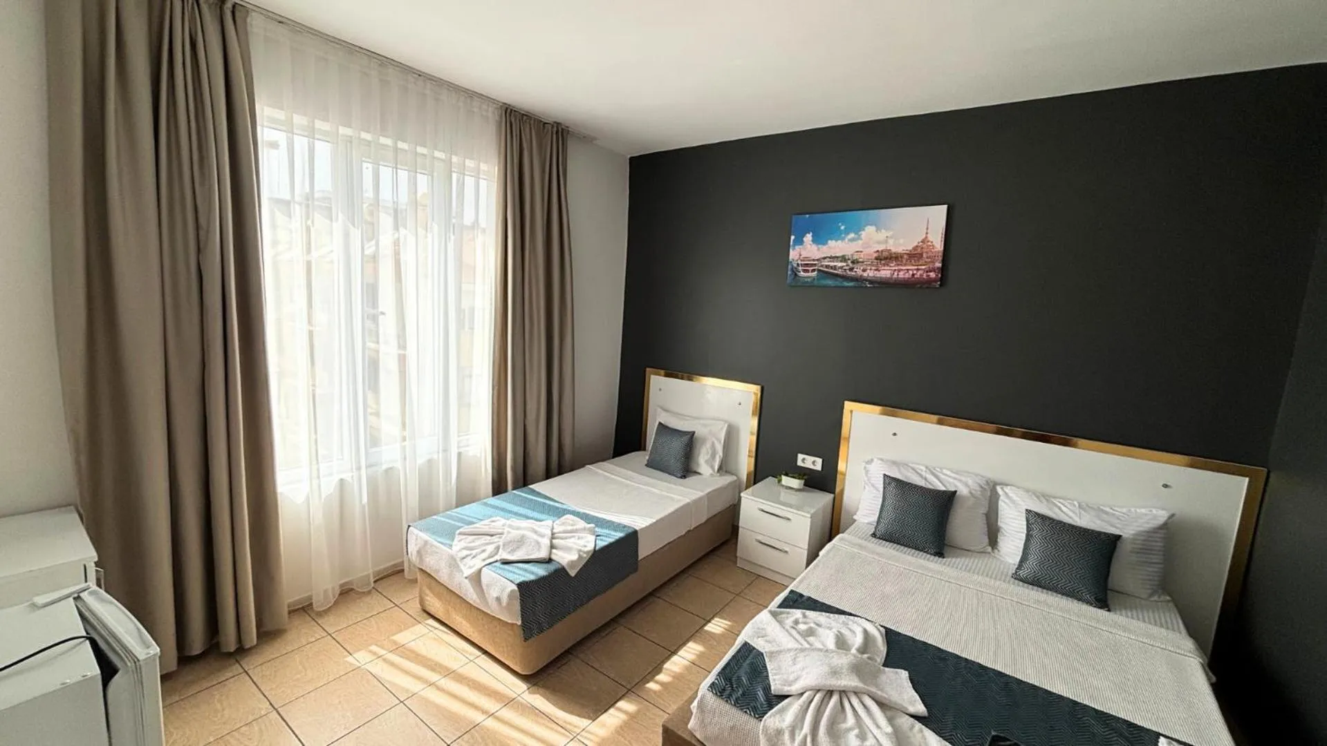 Bed in MOONBOW BEACH HOTEL