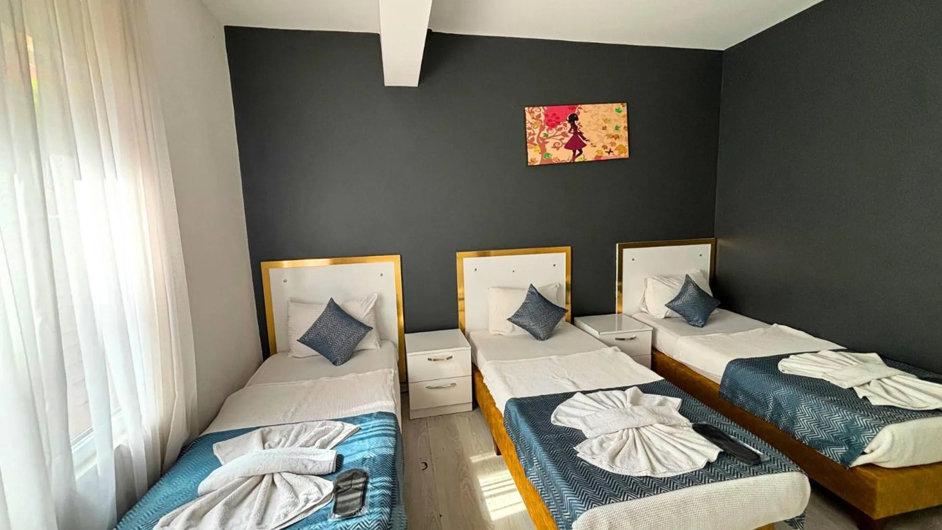 Bed in MOONBOW BEACH HOTEL