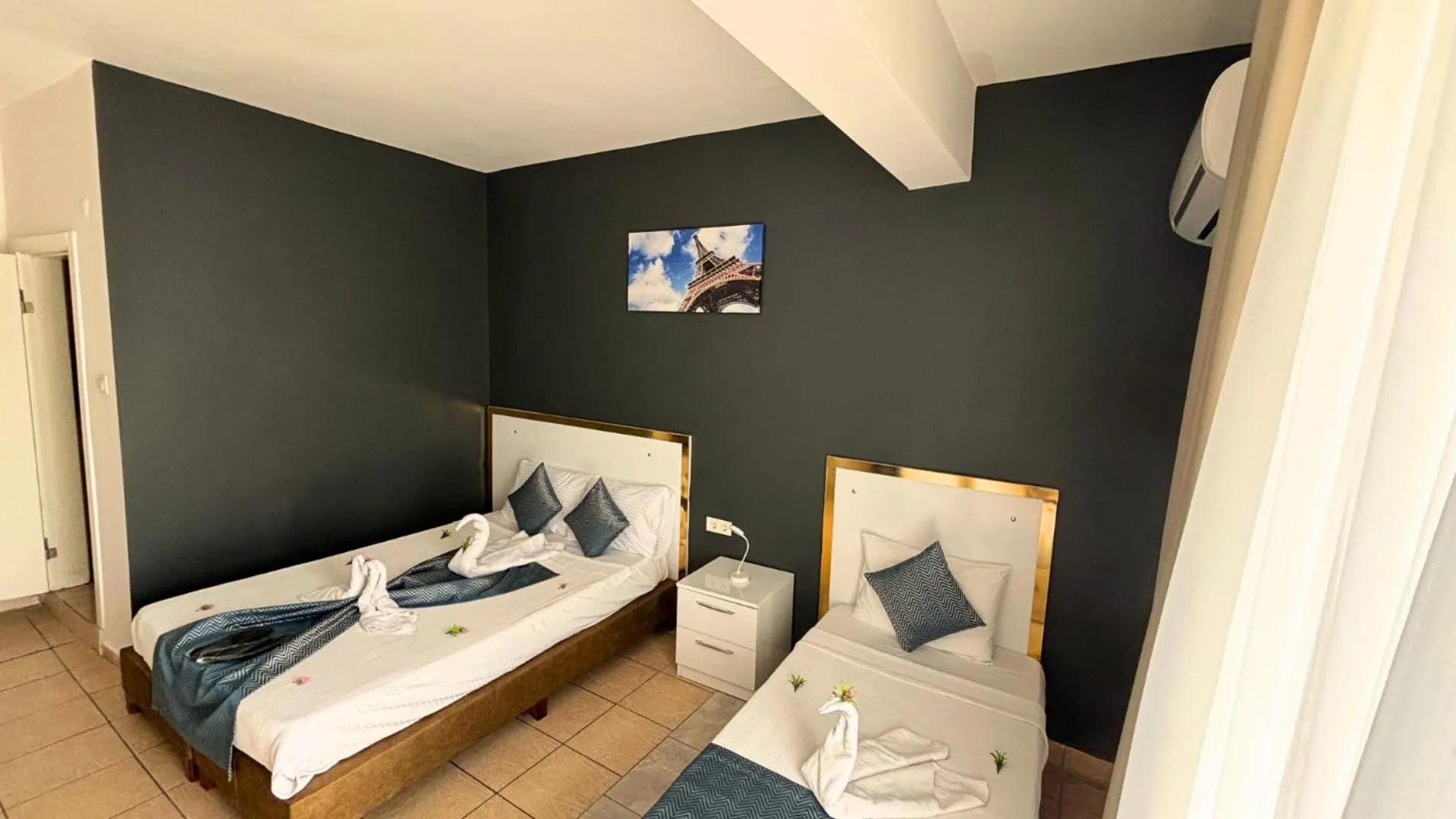 Bed in MOONBOW BEACH HOTEL