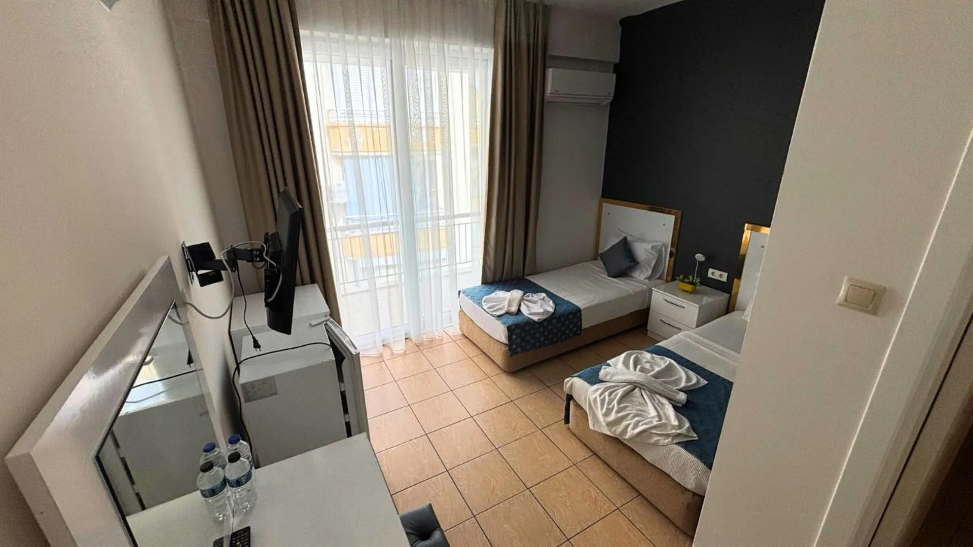 Bed in MOONBOW BEACH HOTEL