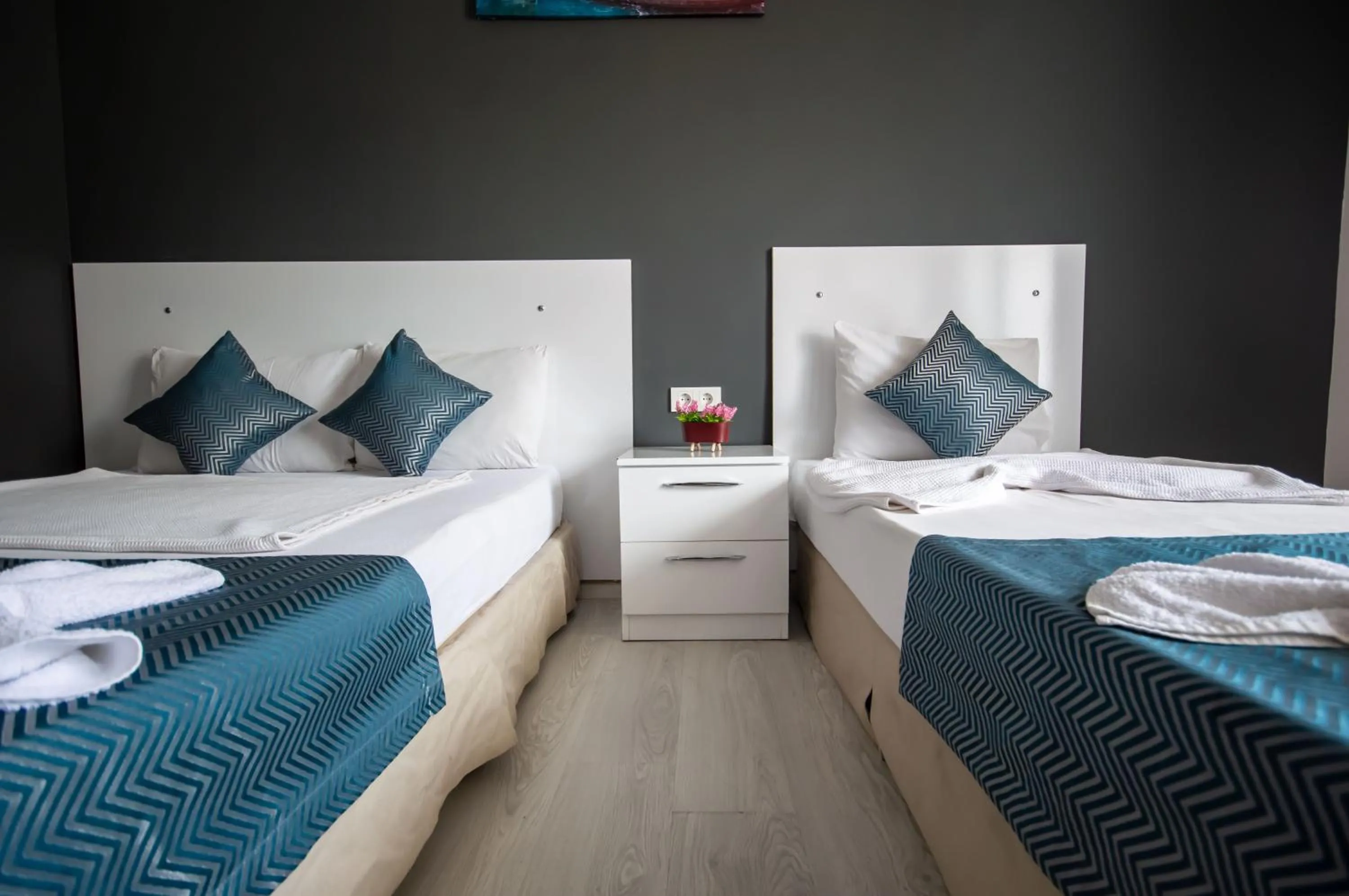 Bed in MOONBOW BEACH HOTEL