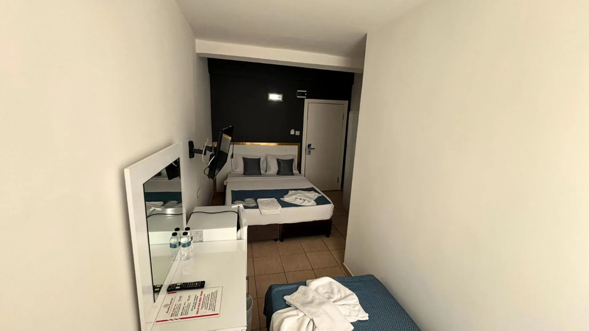 Bed in MOONBOW BEACH HOTEL