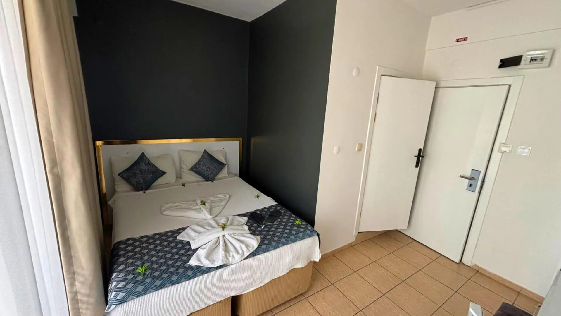 Bed in MOONBOW BEACH HOTEL