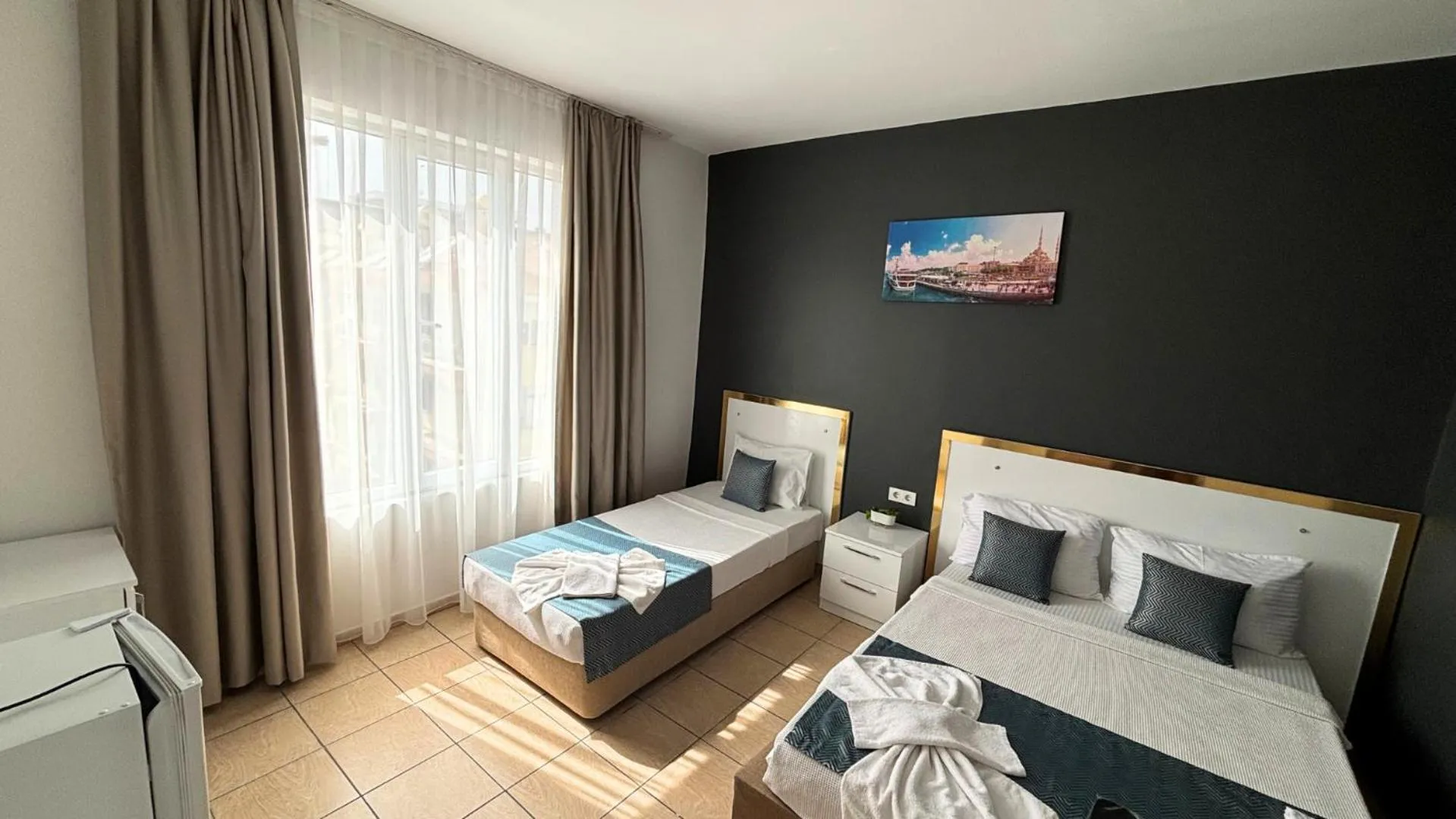 Bed in MOONBOW BEACH HOTEL