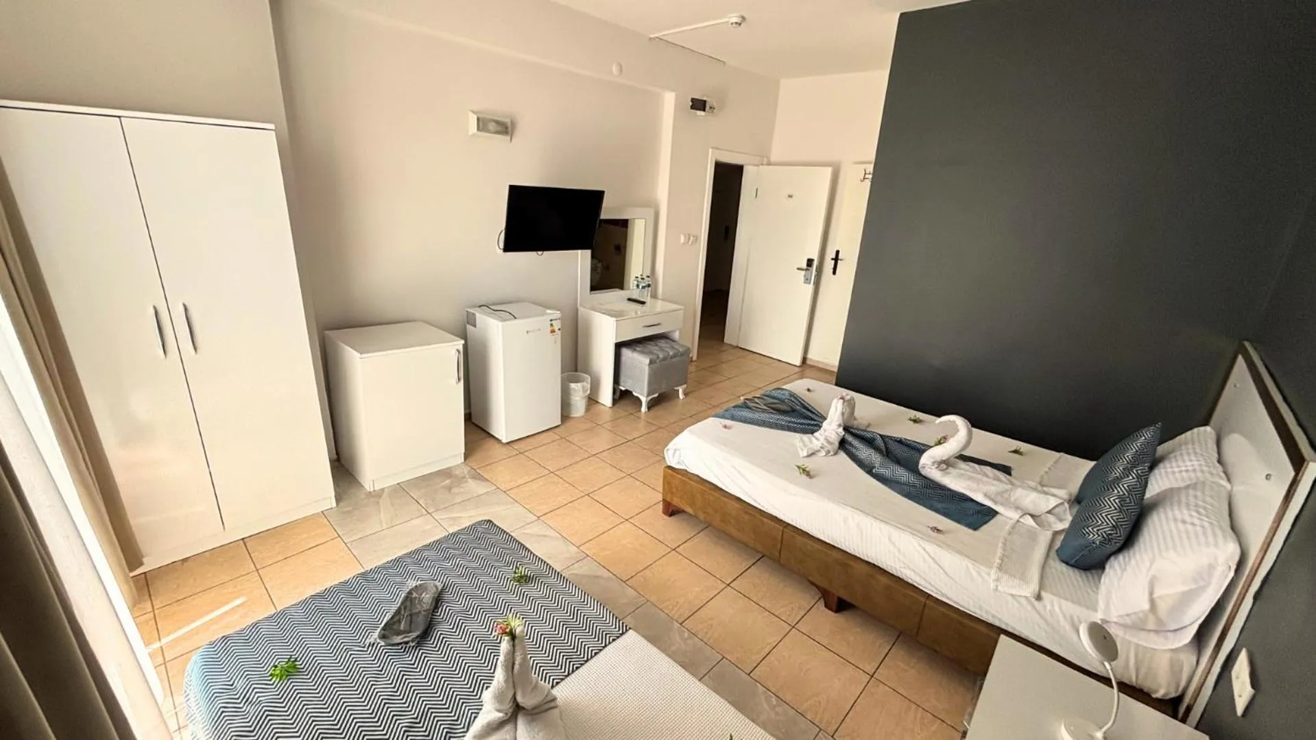 Bed in MOONBOW BEACH HOTEL