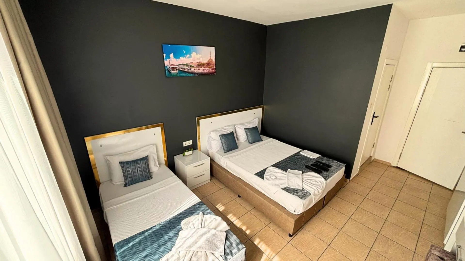 Bed in MOONBOW BEACH HOTEL