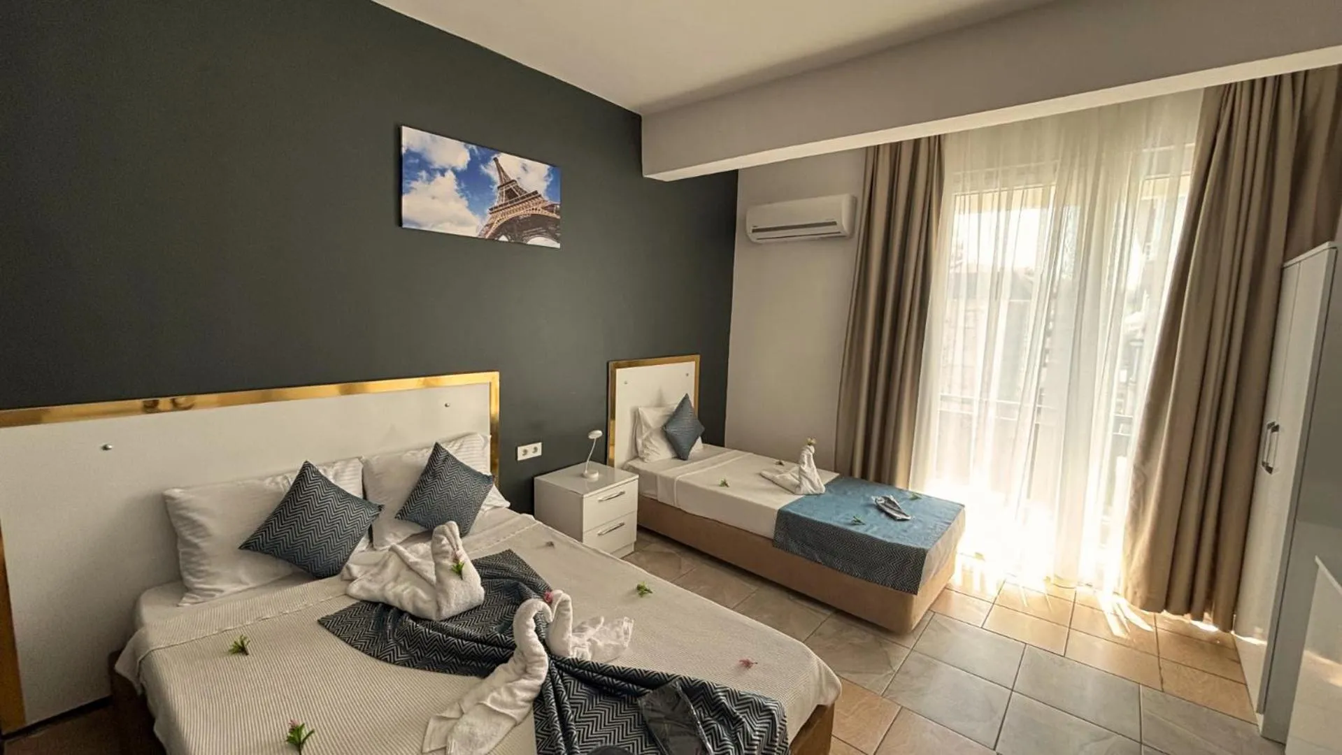 Bed in MOONBOW BEACH HOTEL