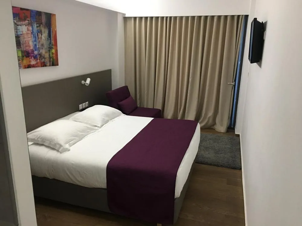 Bed in Olympos Suites Apartments