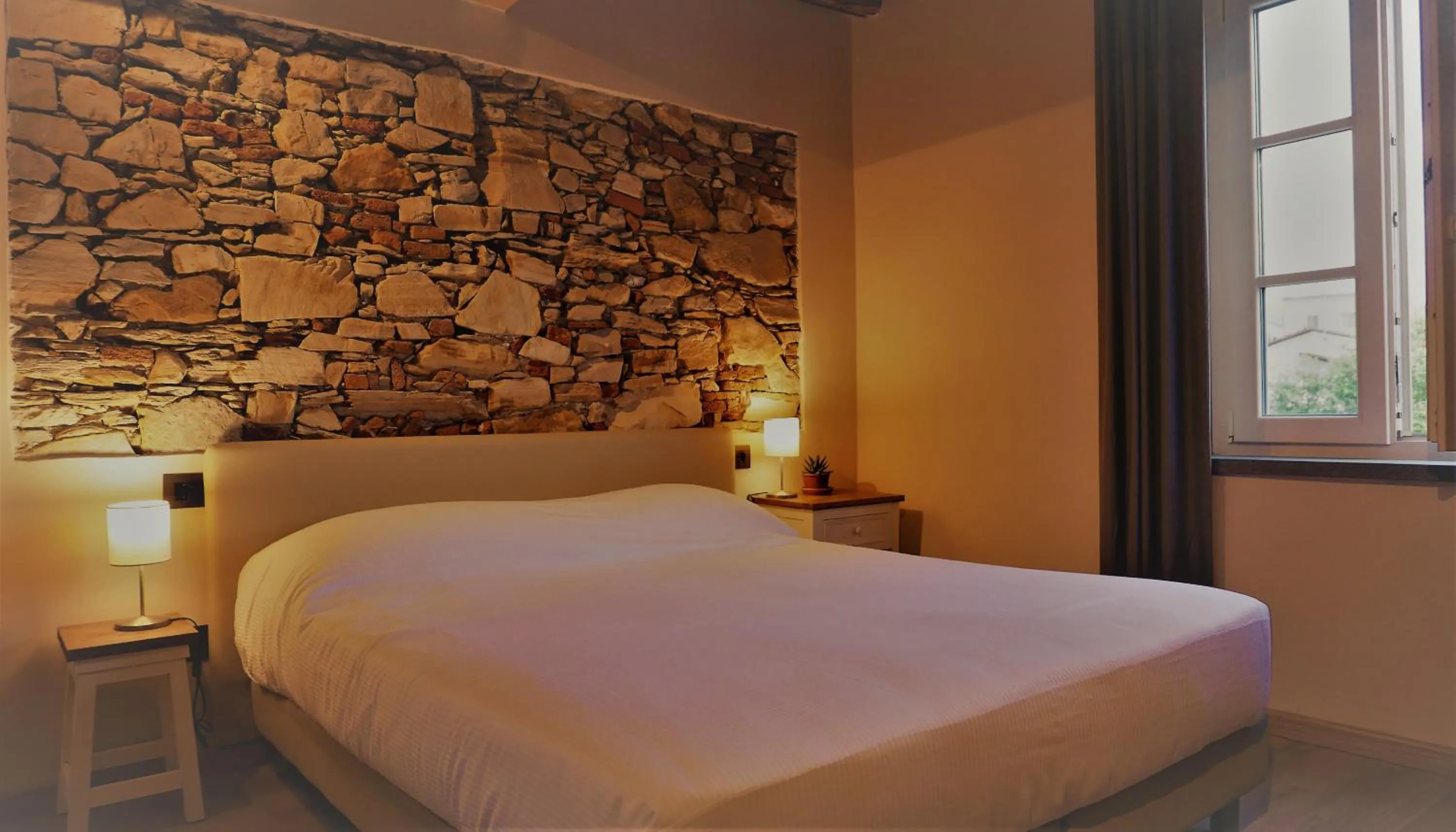 Bed in Il Tiglio Jacuzzi&Sauna