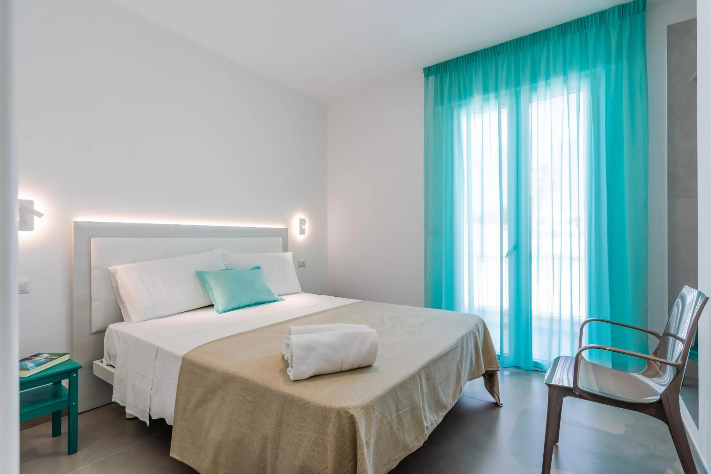 Bed in SMERALDO RESIDENCE