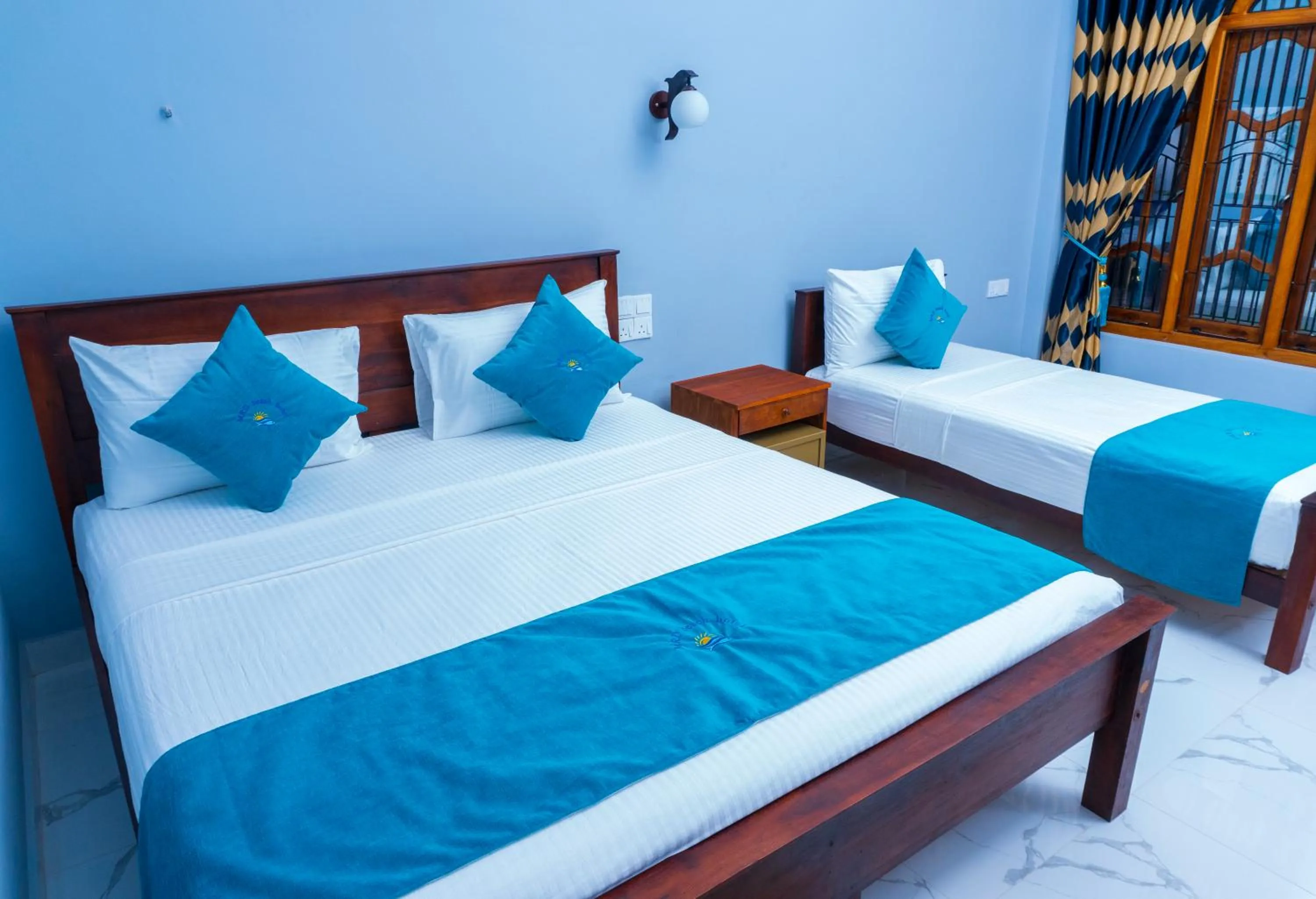 Bed in MRD Beach Hotel