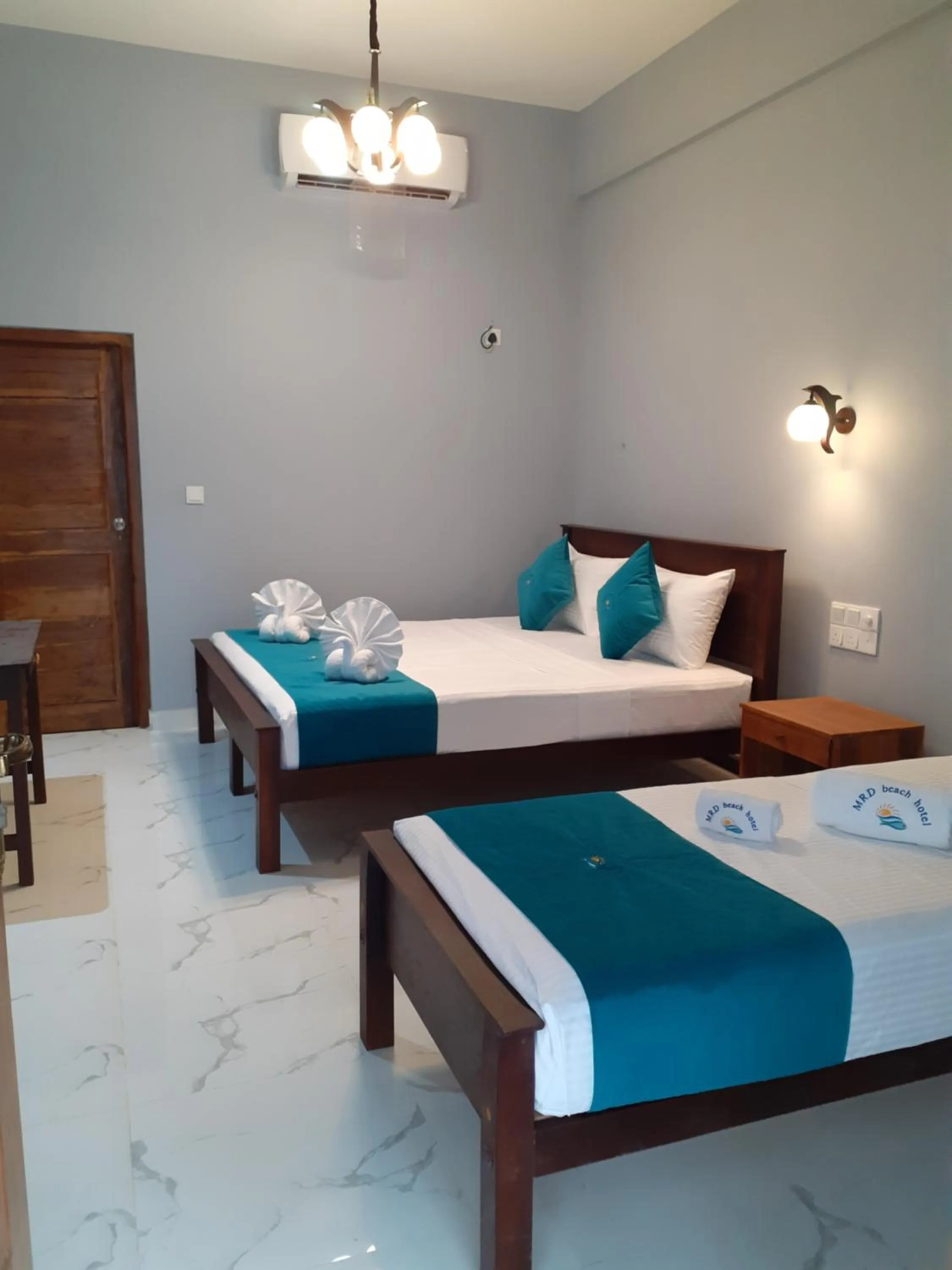 Bed in MRD Beach Hotel