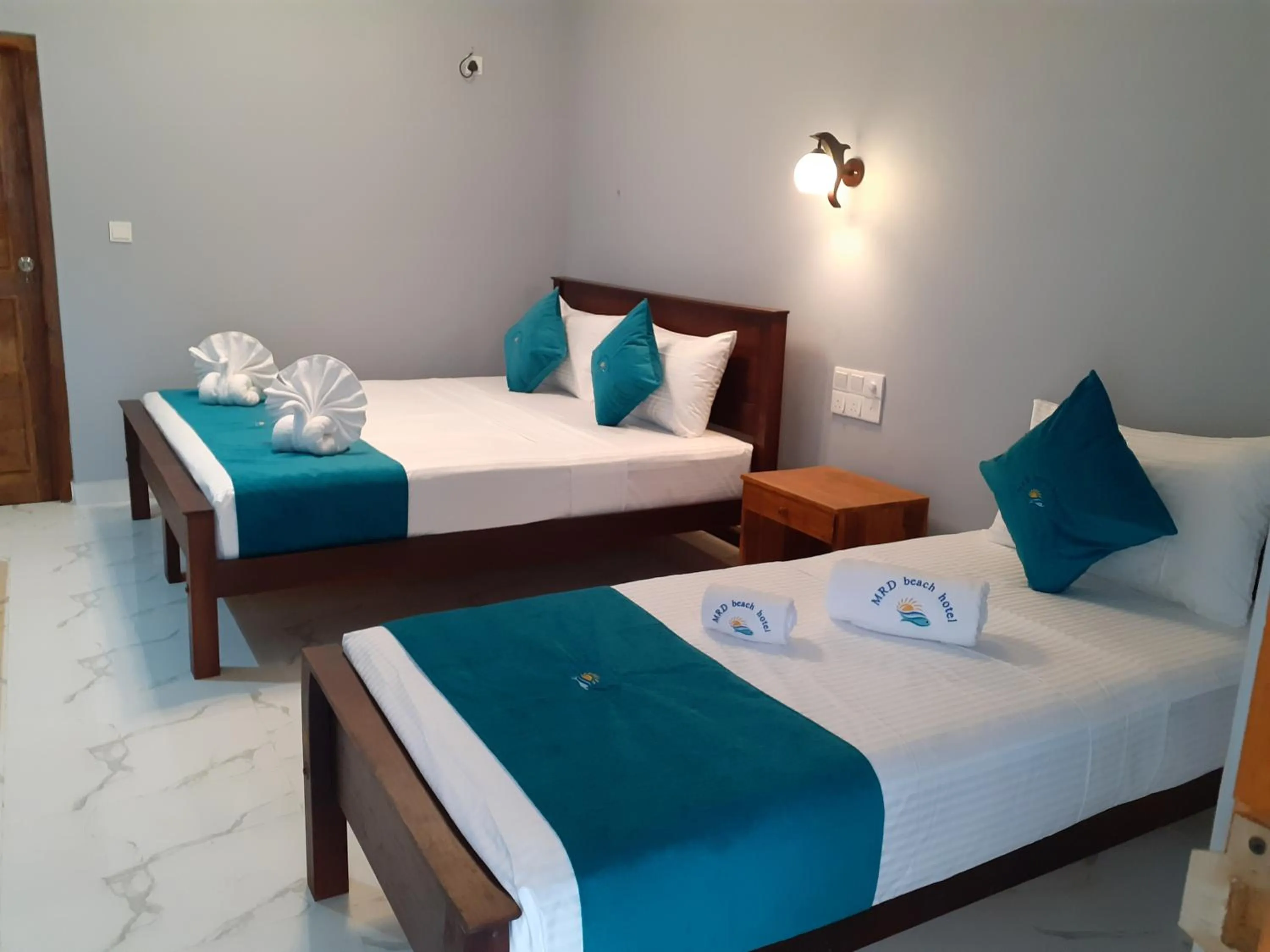 Bed in MRD Beach Hotel
