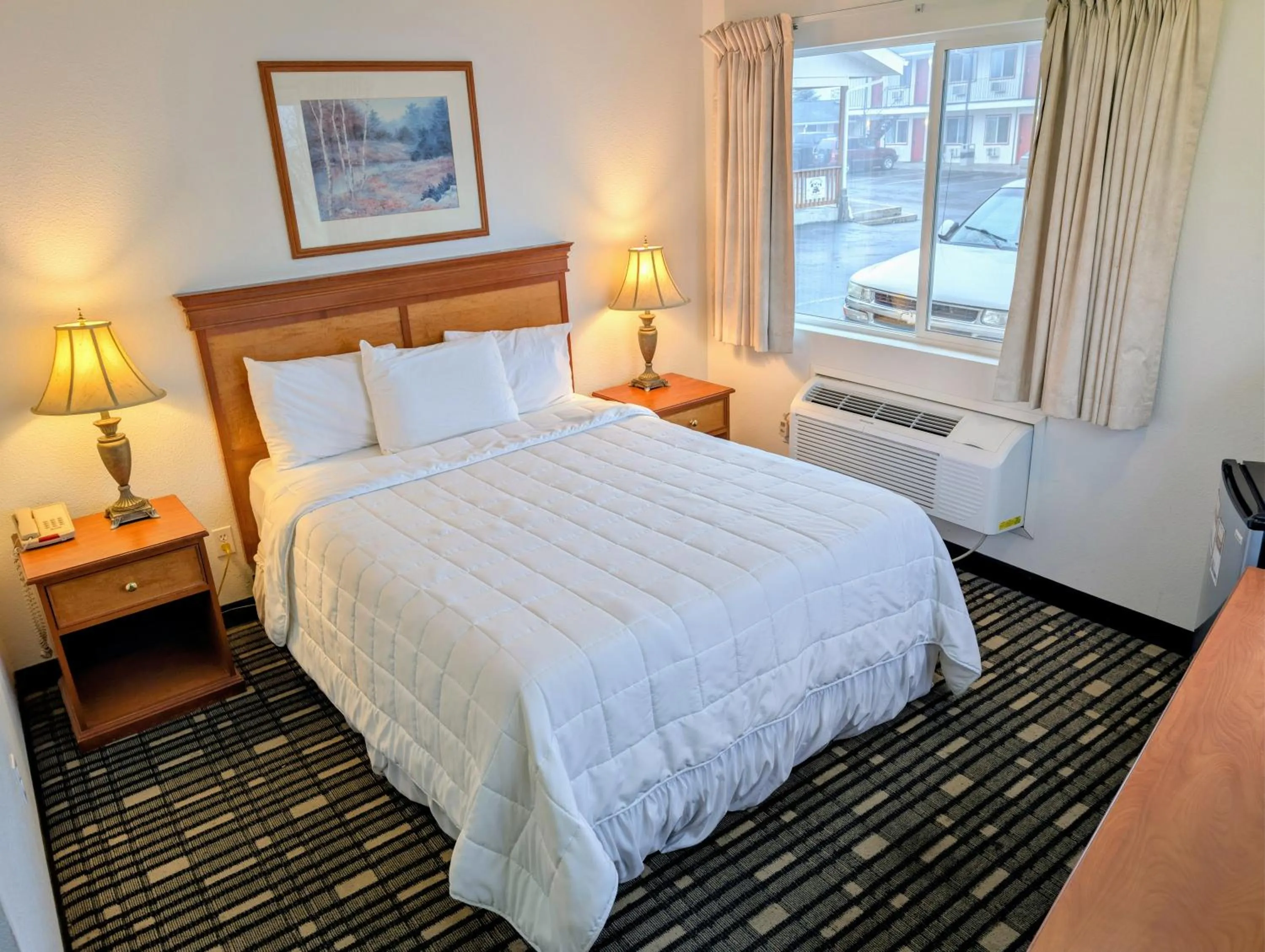 Bed in Ponderosa Motel