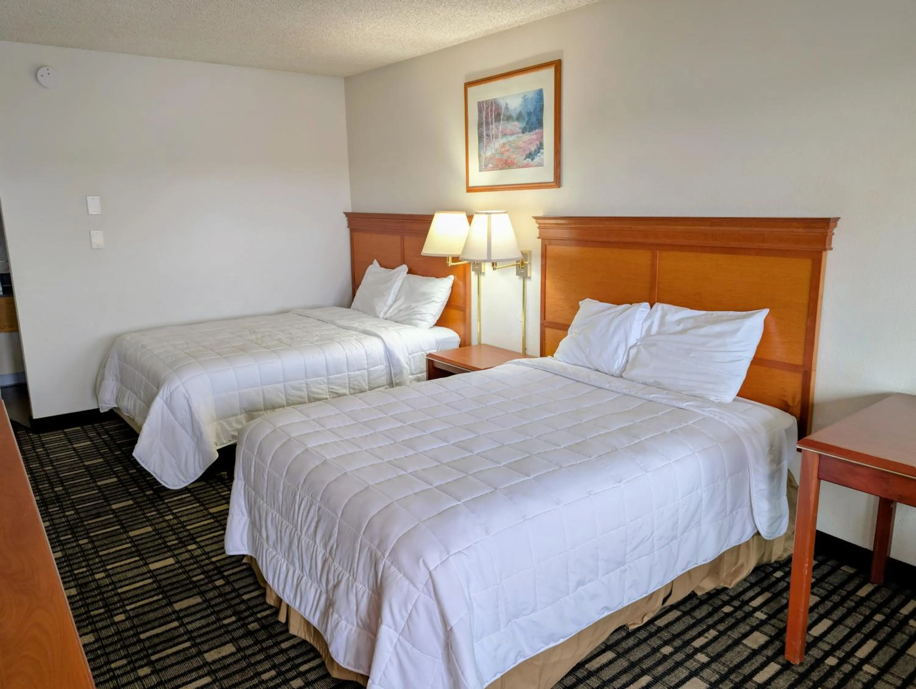 Bed in Ponderosa Motel