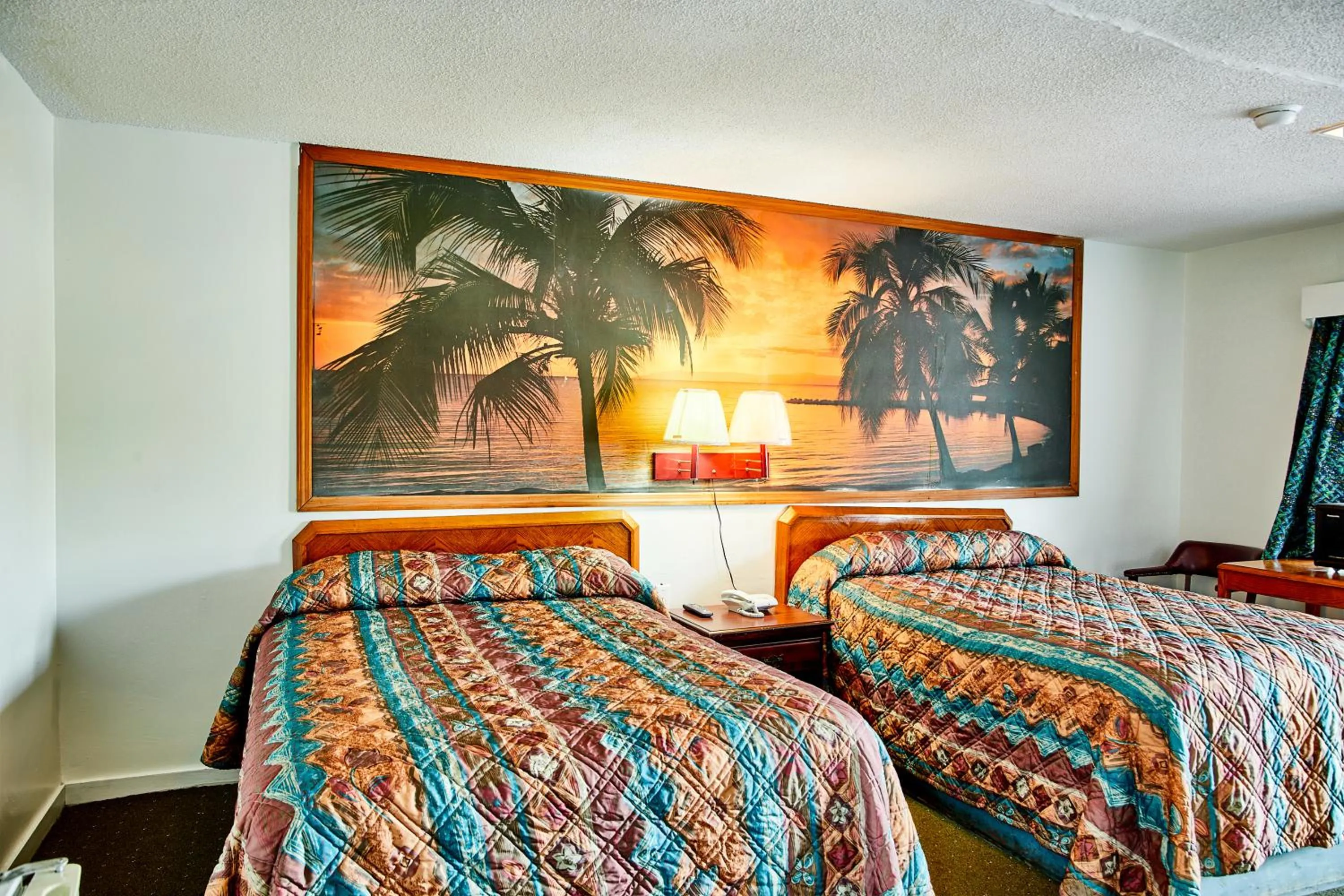 Bedroom in Hospitality Inn