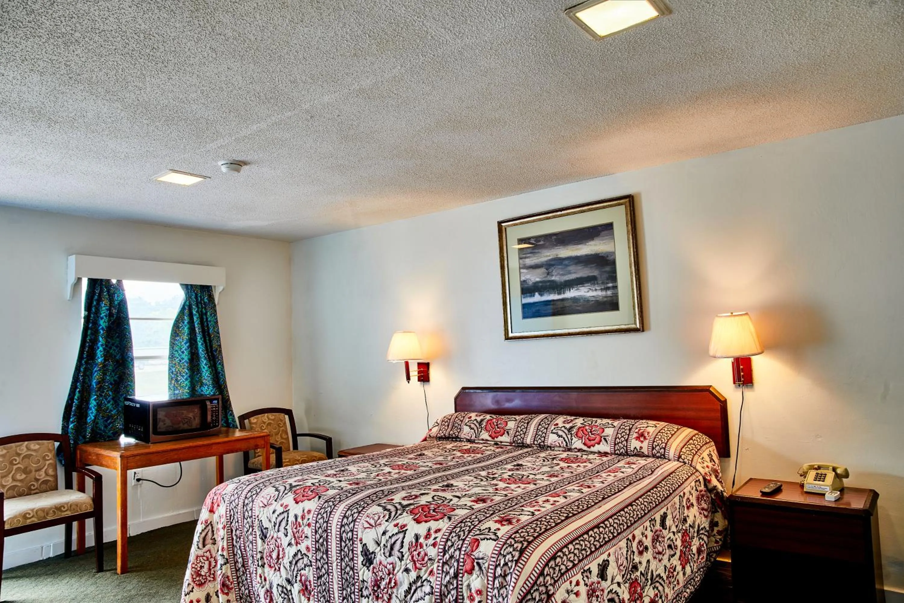 Bedroom in Hospitality Inn