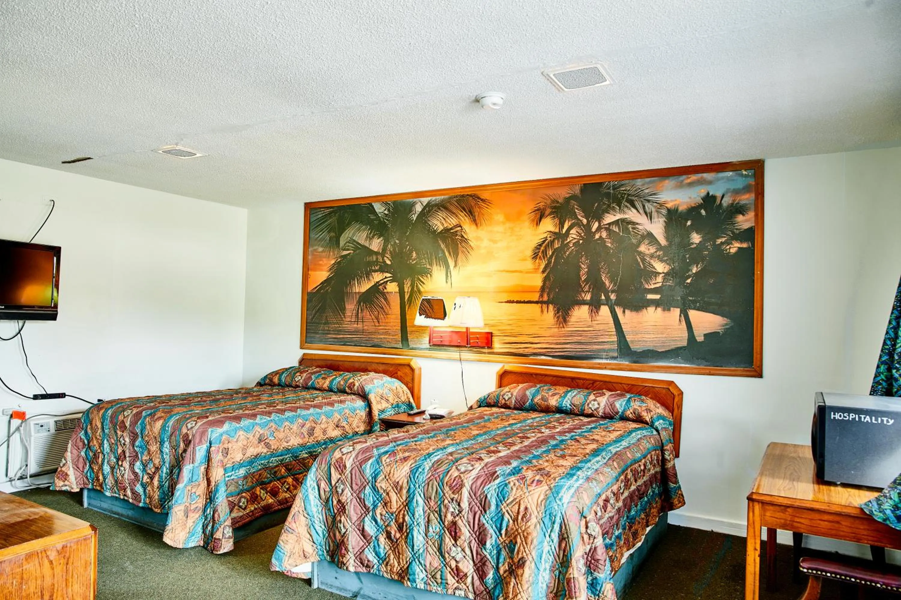 Bedroom in Hospitality Inn