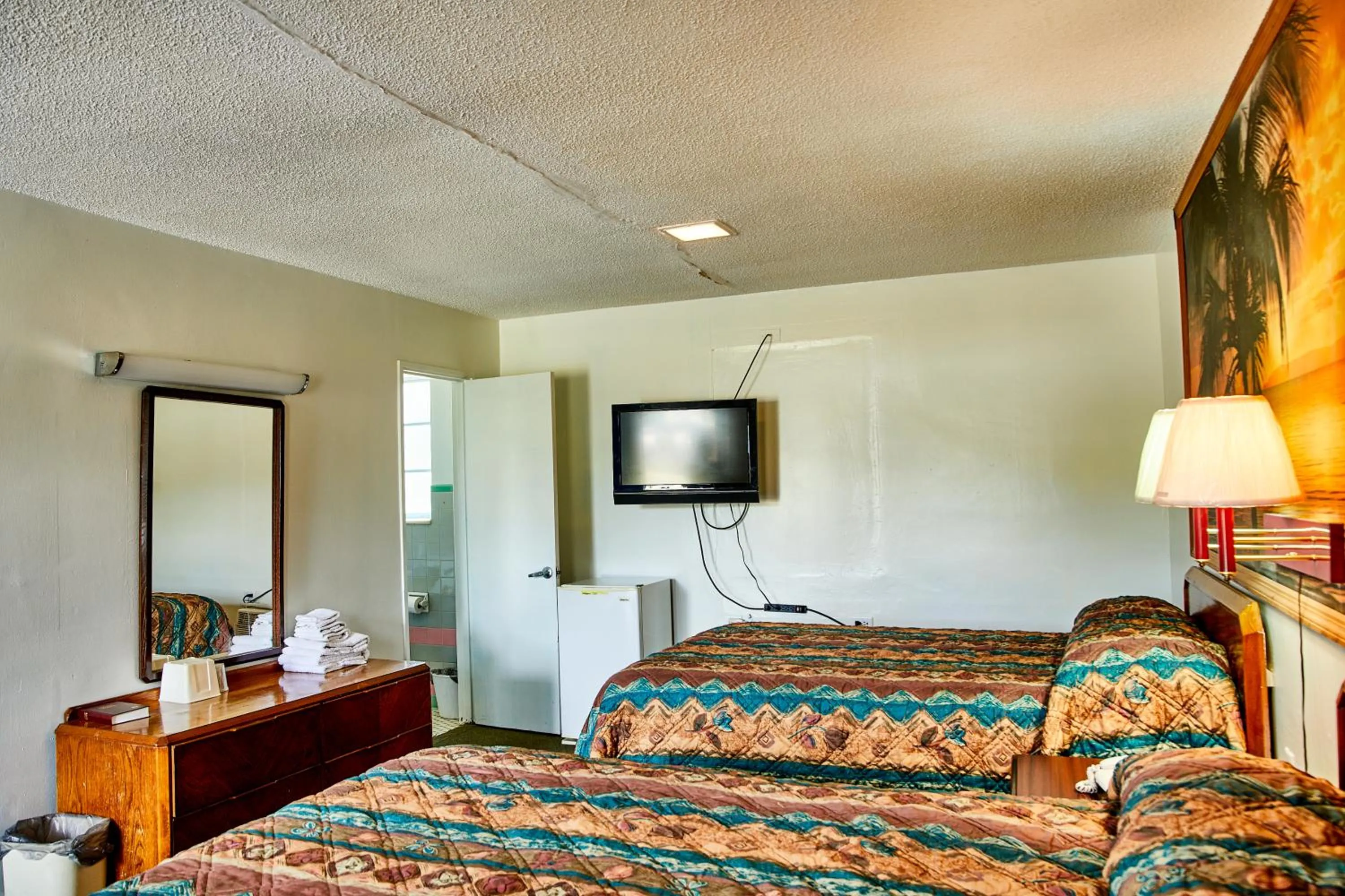 Bedroom in Hospitality Inn