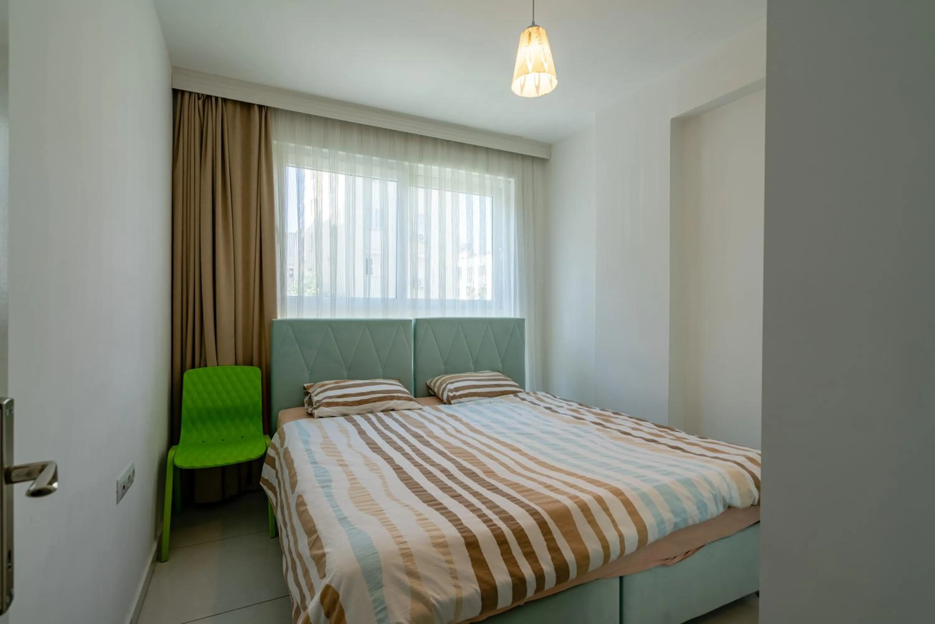 Bed in Sare Suites Downtown