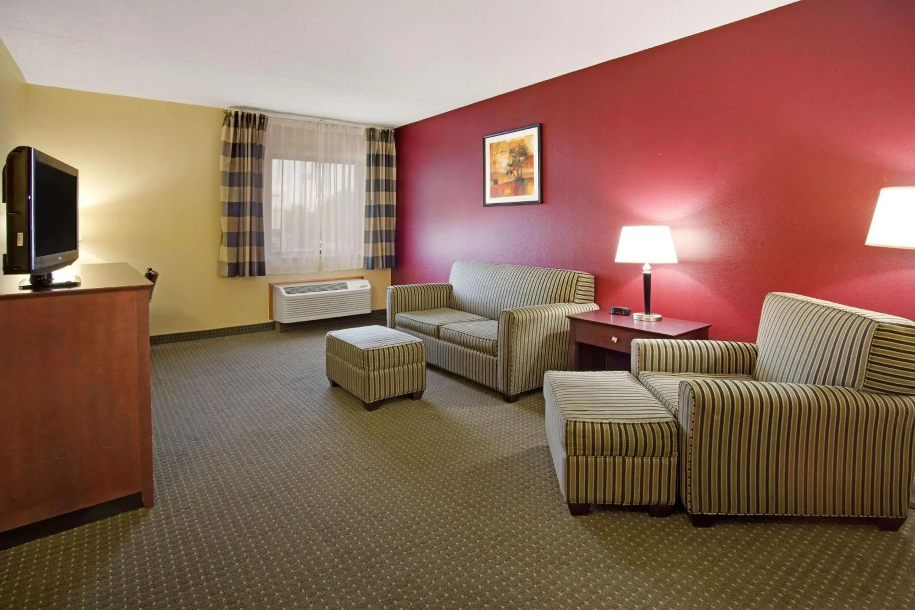 Photo of the whole room, Seating Area in Ramada by Wyndham Bettendorf