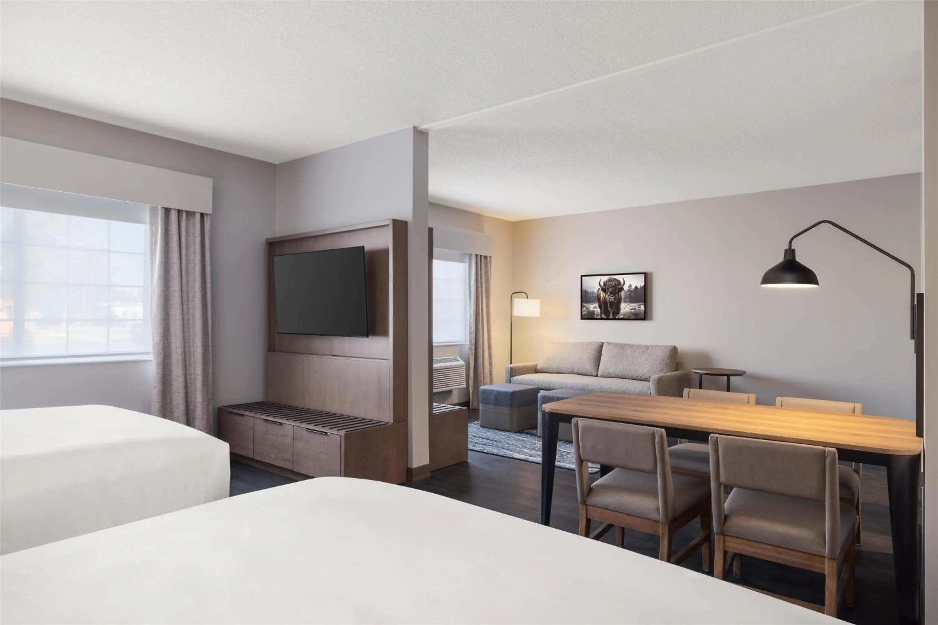 Living room, Bed in Starlite Yellowstone, Tapestry Collection by Hilton