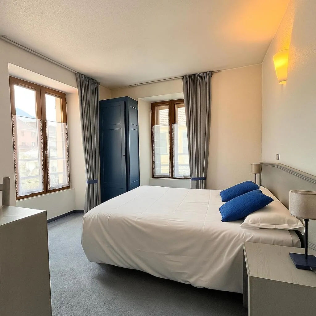 Bed in Logis Hôtel de Genève et Restaurant , Faverges-Seythenex