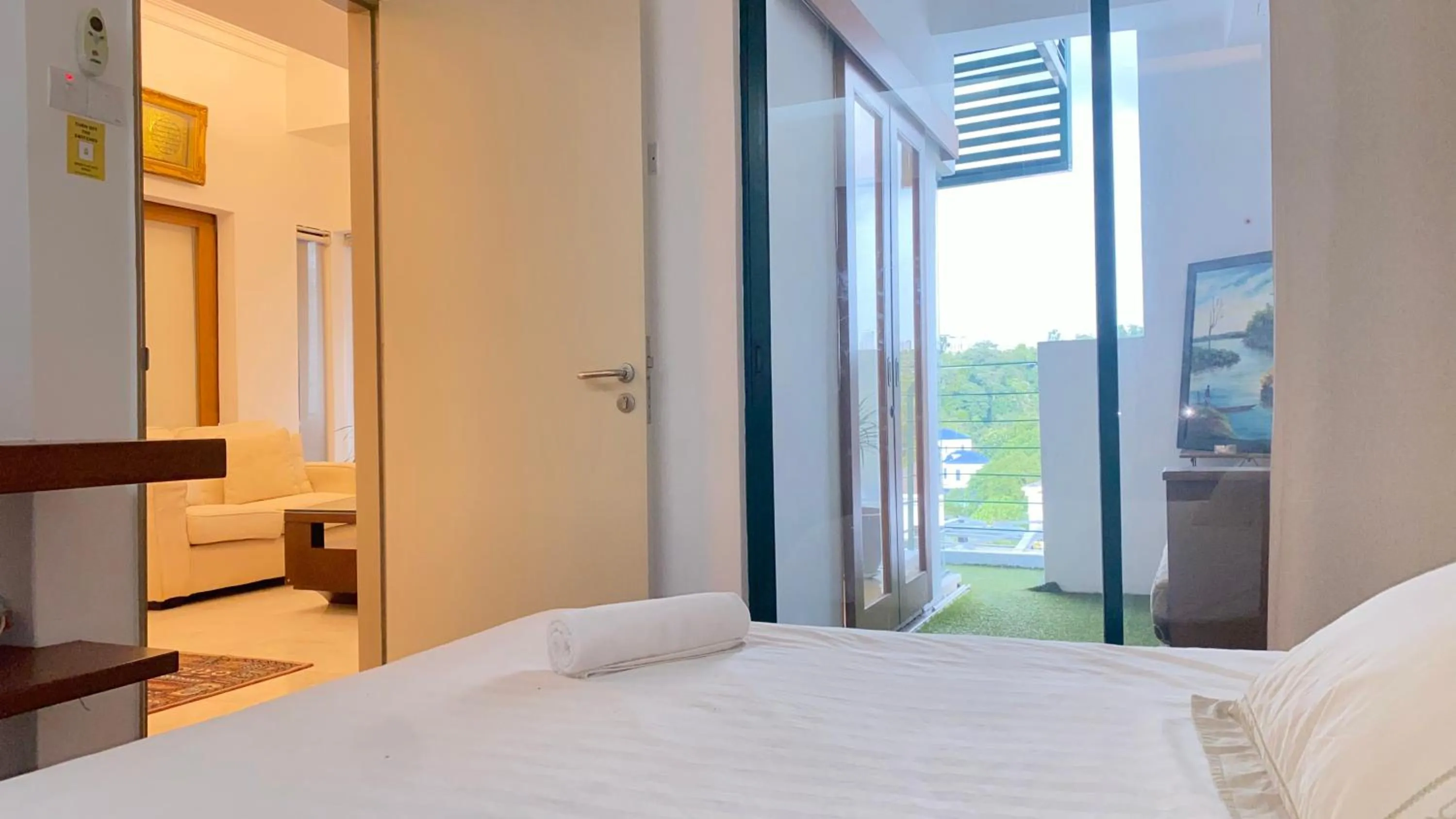 Bed in Peninsula Residence All Suite Hotel