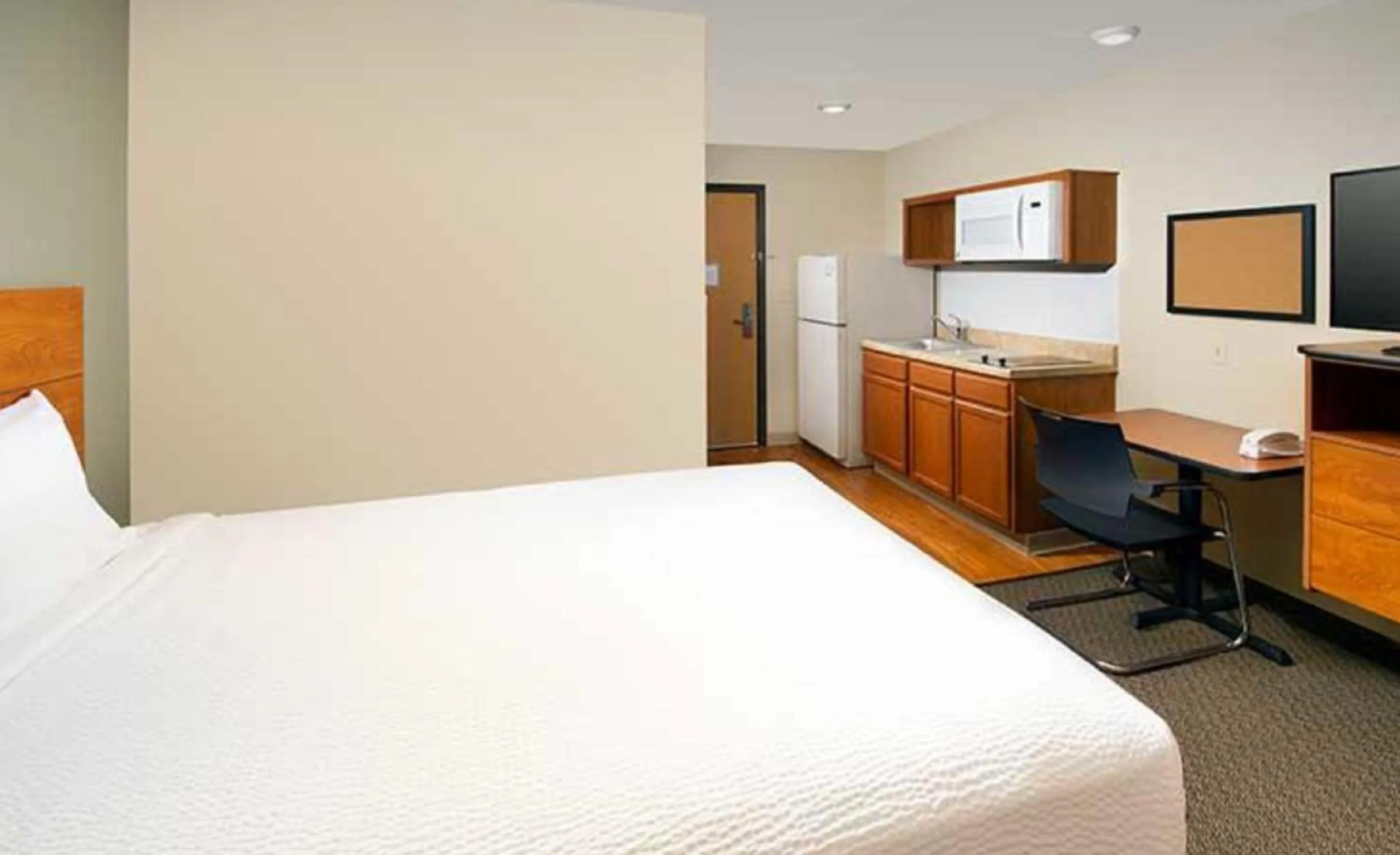 Photo of the whole room, Bed in WoodSpring Suites Dallas Rockwall