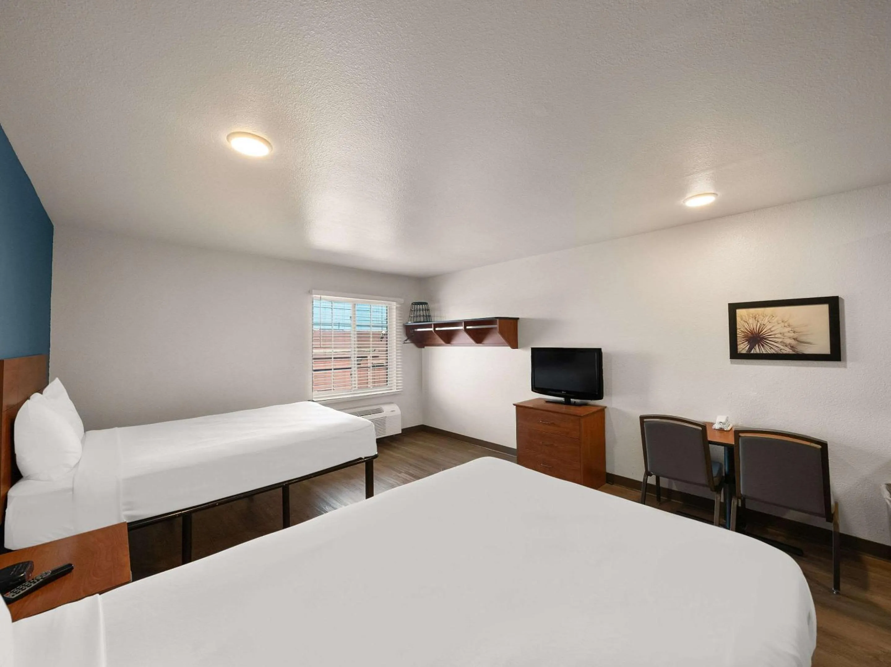 Bedroom, Bed in WoodSpring Suites Dallas Rockwall