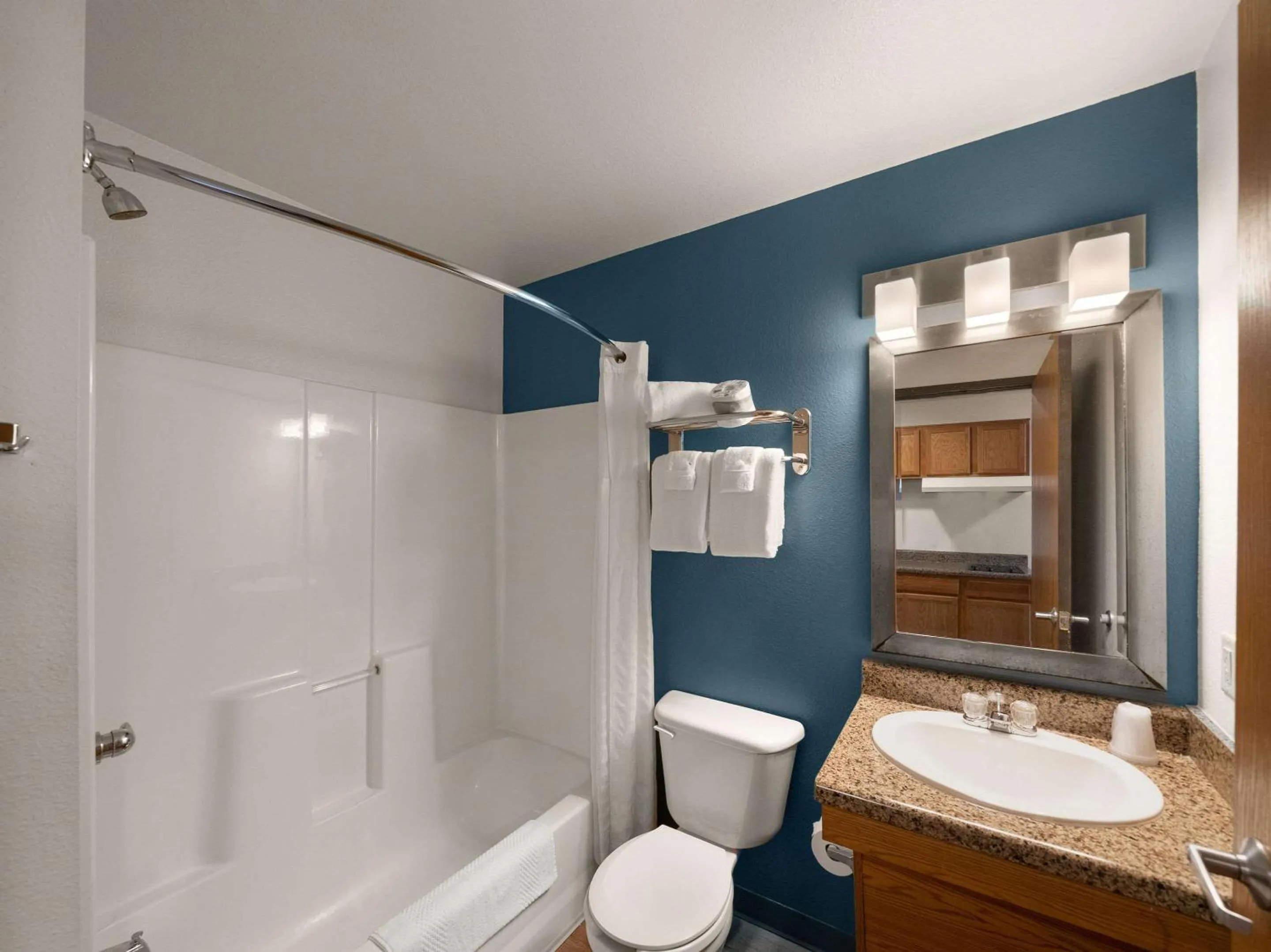 Bedroom in WoodSpring Suites Dallas Rockwall