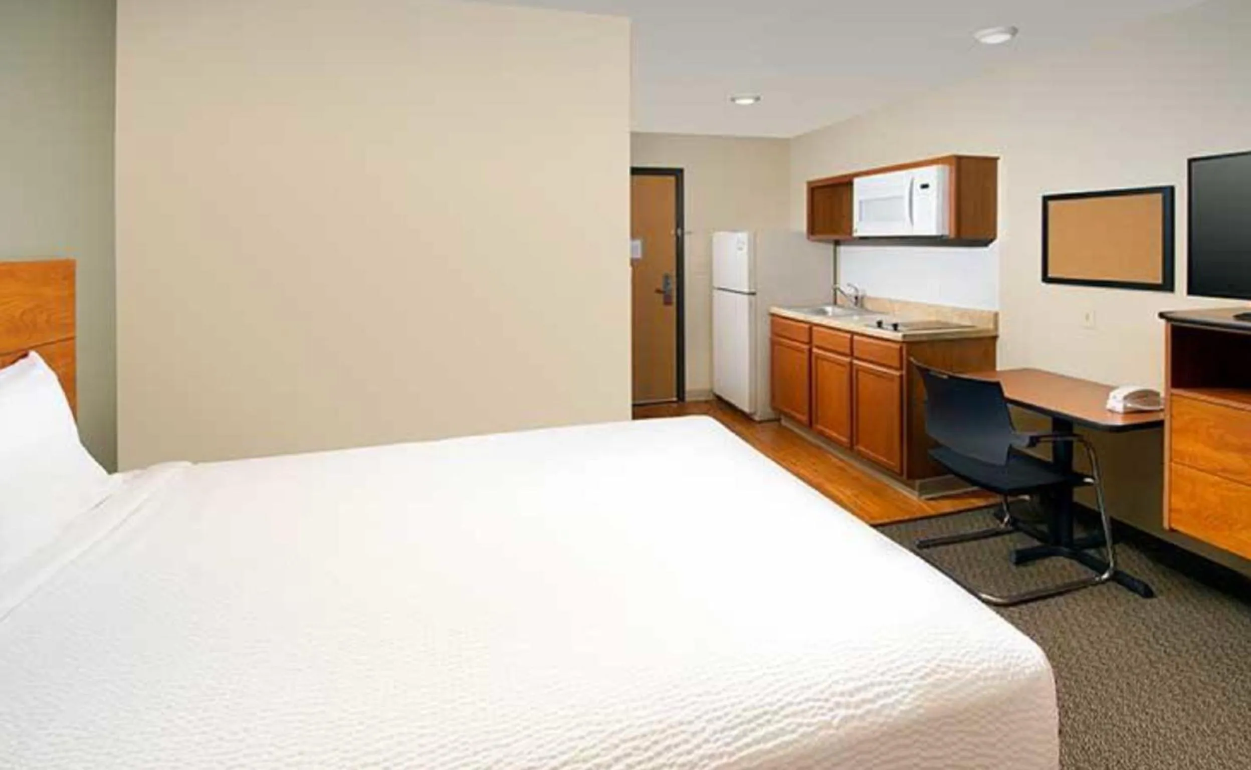 Photo of the whole room, Bed in WoodSpring Suites Dallas Rockwall