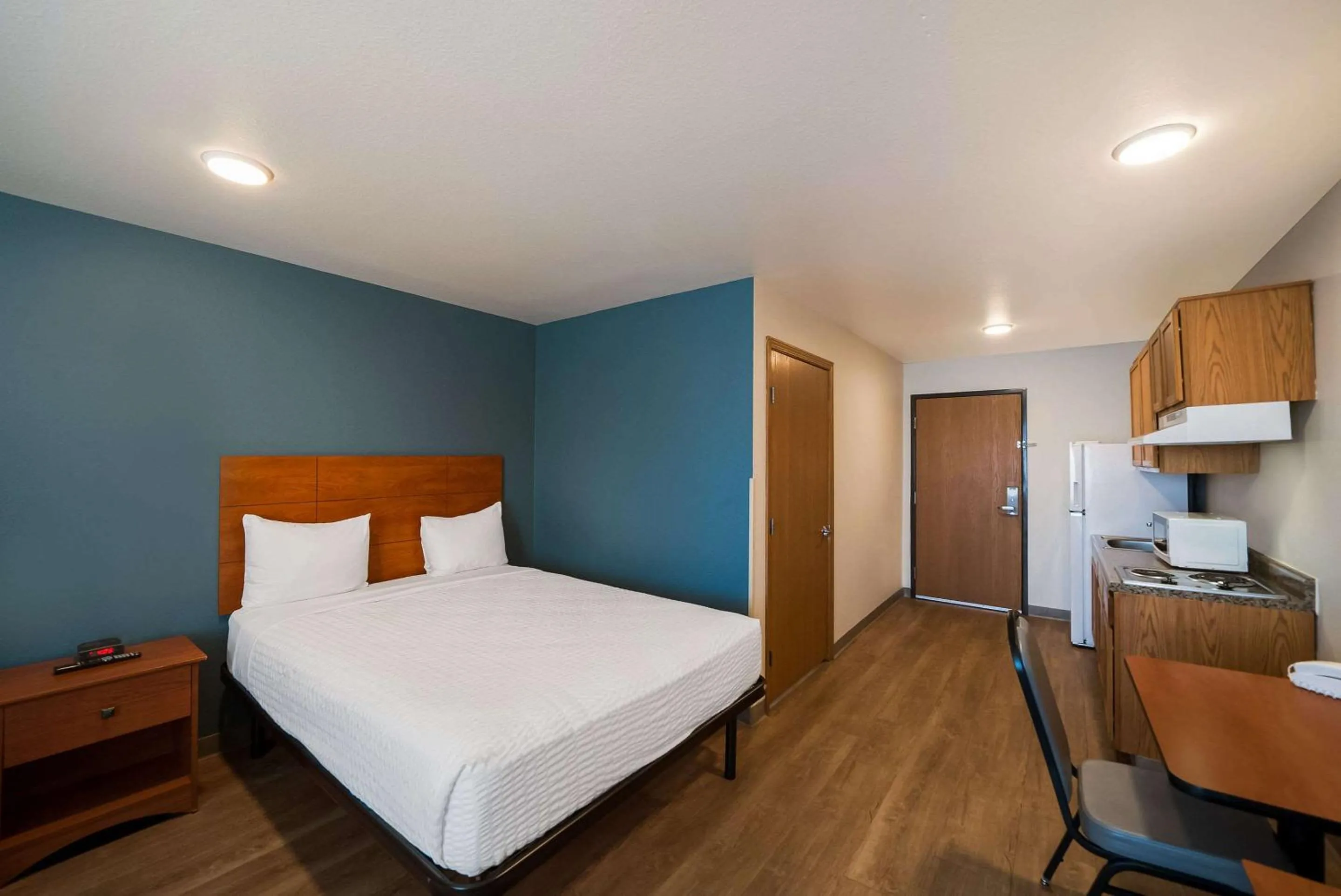 Bedroom, Bed in WoodSpring Suites Fort Worth Fossil Creek